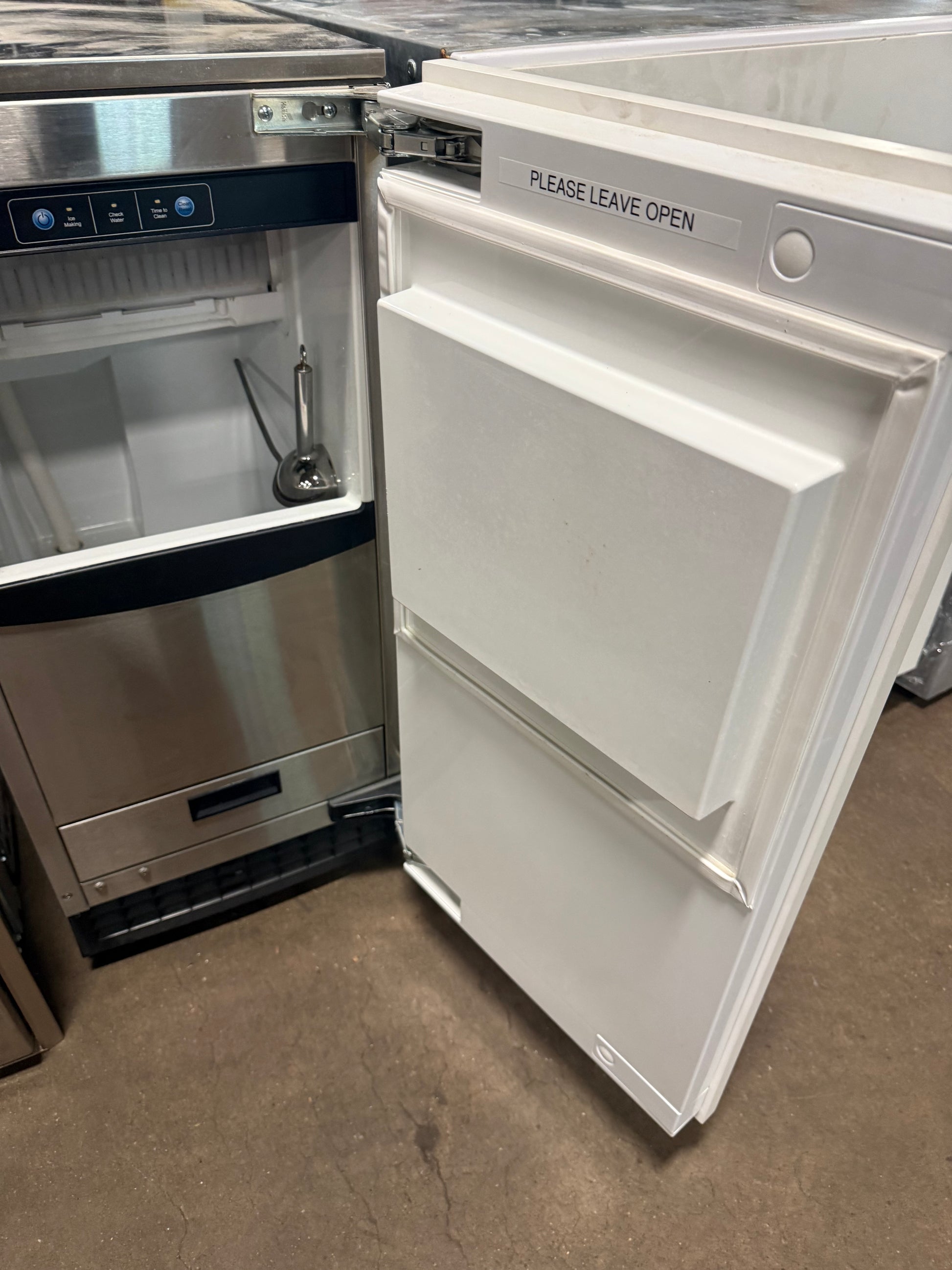 Close up view of the control panel and custom panel door hinge on the Scotsman undercounter ice maker
