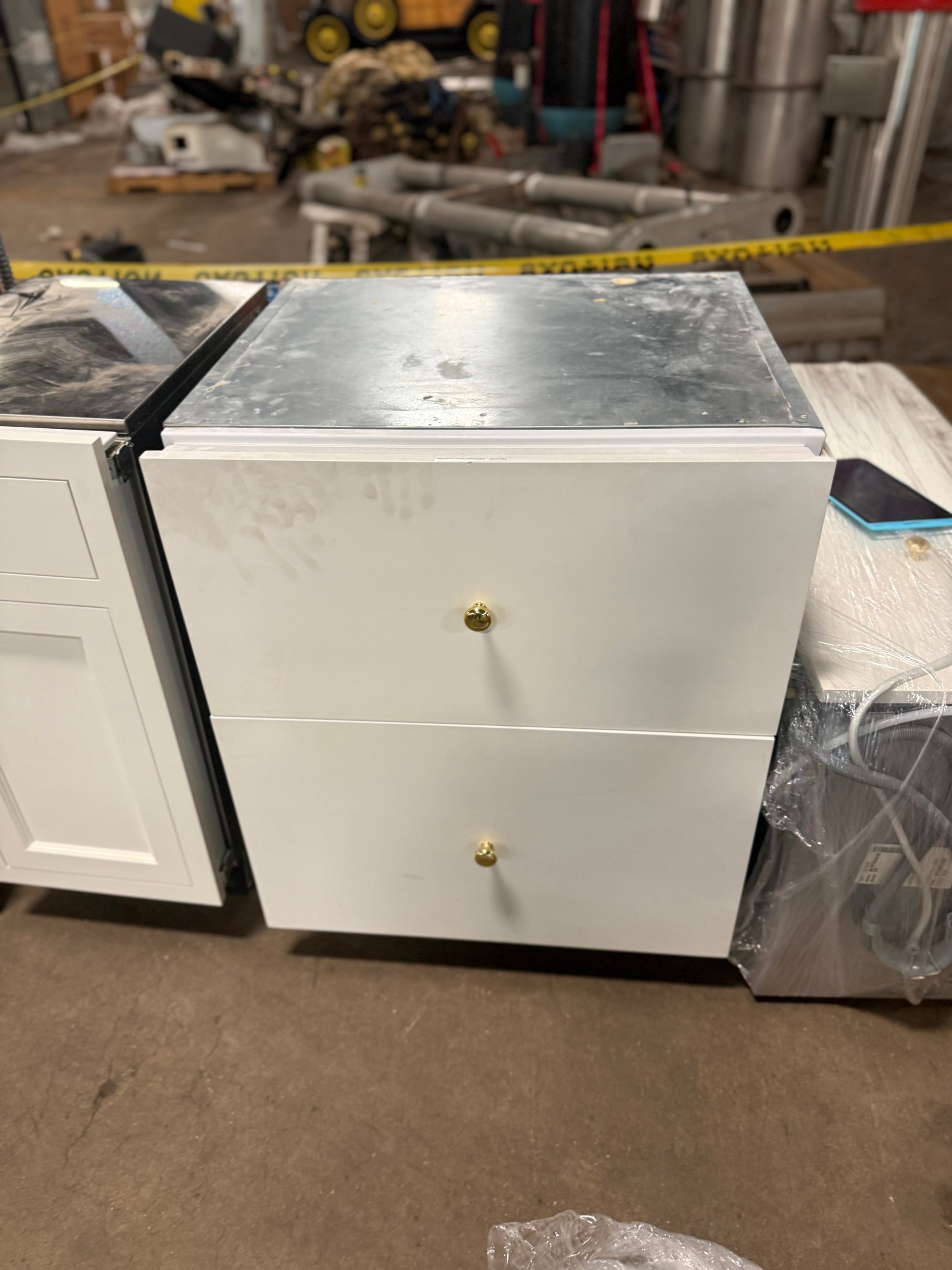 Sub-Zero panel ready pull out refrigerator and freezer drawers in kitchen island