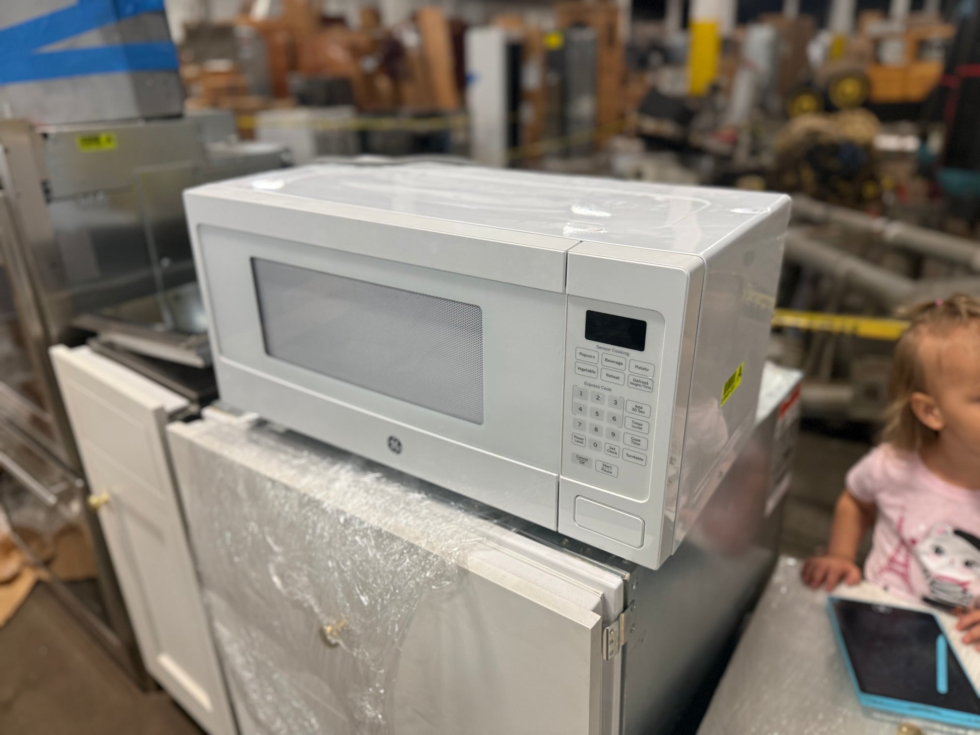 GE Profile 1.1 cu ft countertop microwave oven in white PEM31DFWW