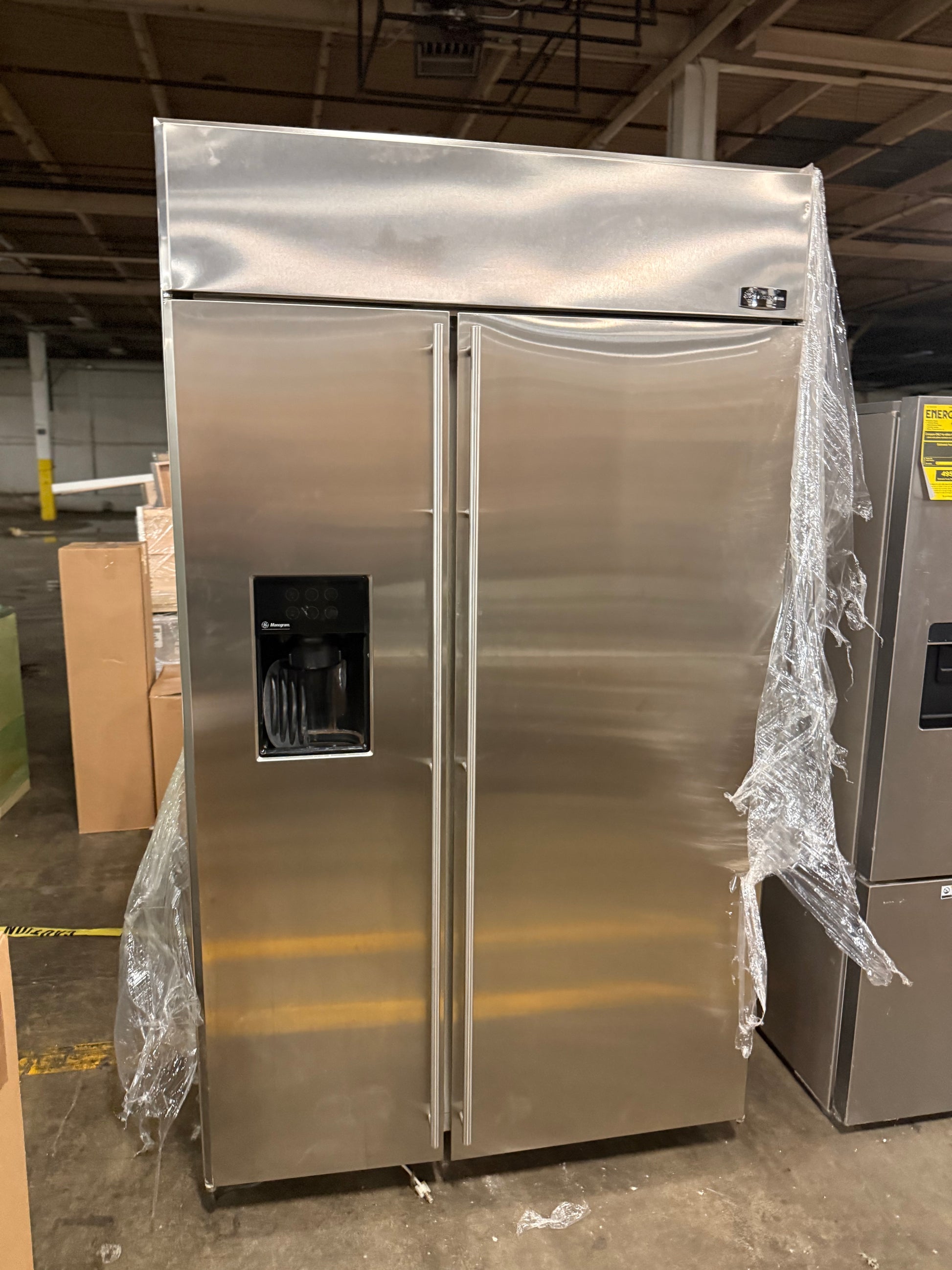 GE Monogram professional stainless steel refrigerator with through-the-door dispenser