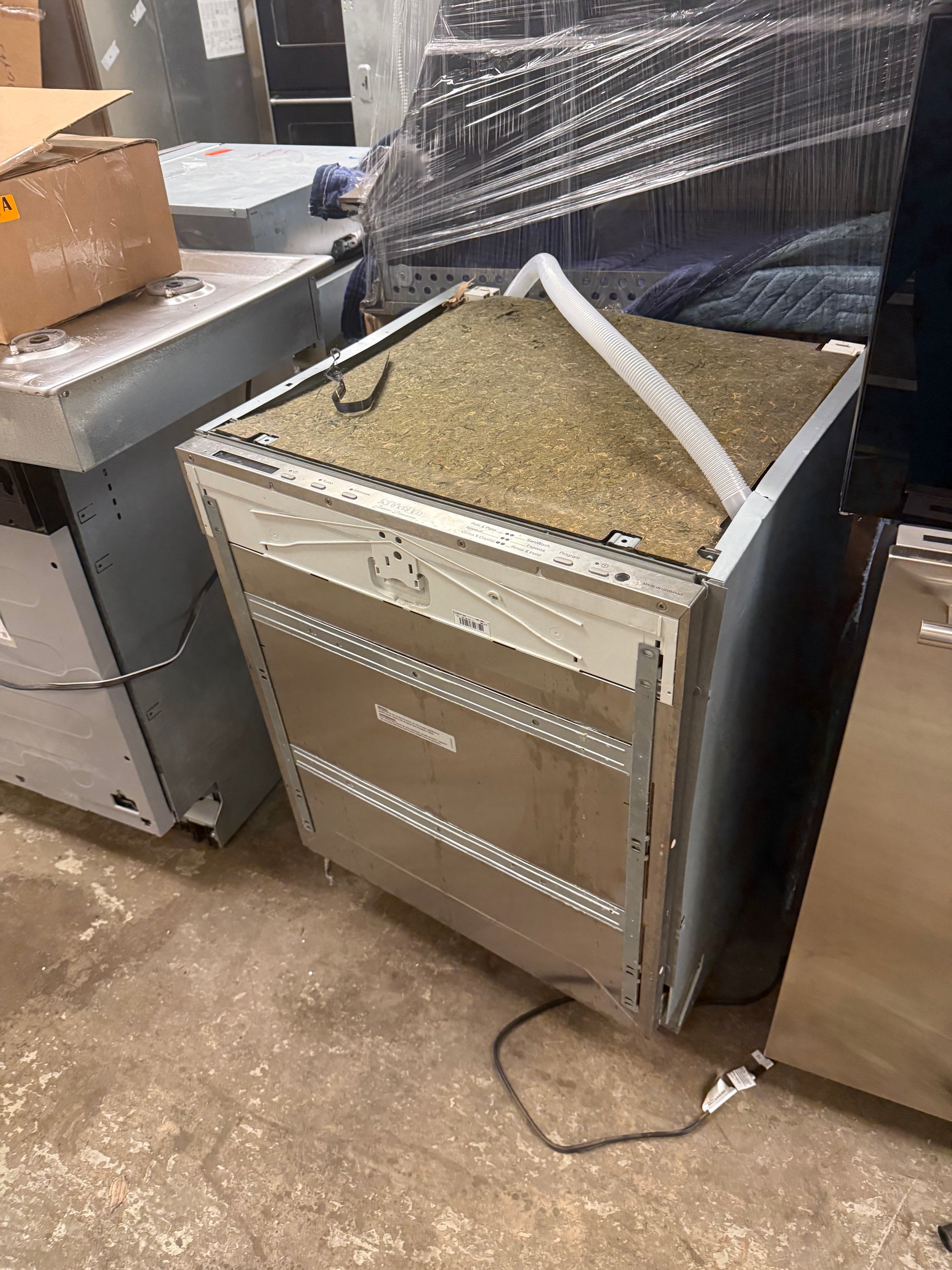 Miele built-in dishwasher with top control panel and custom overlay door