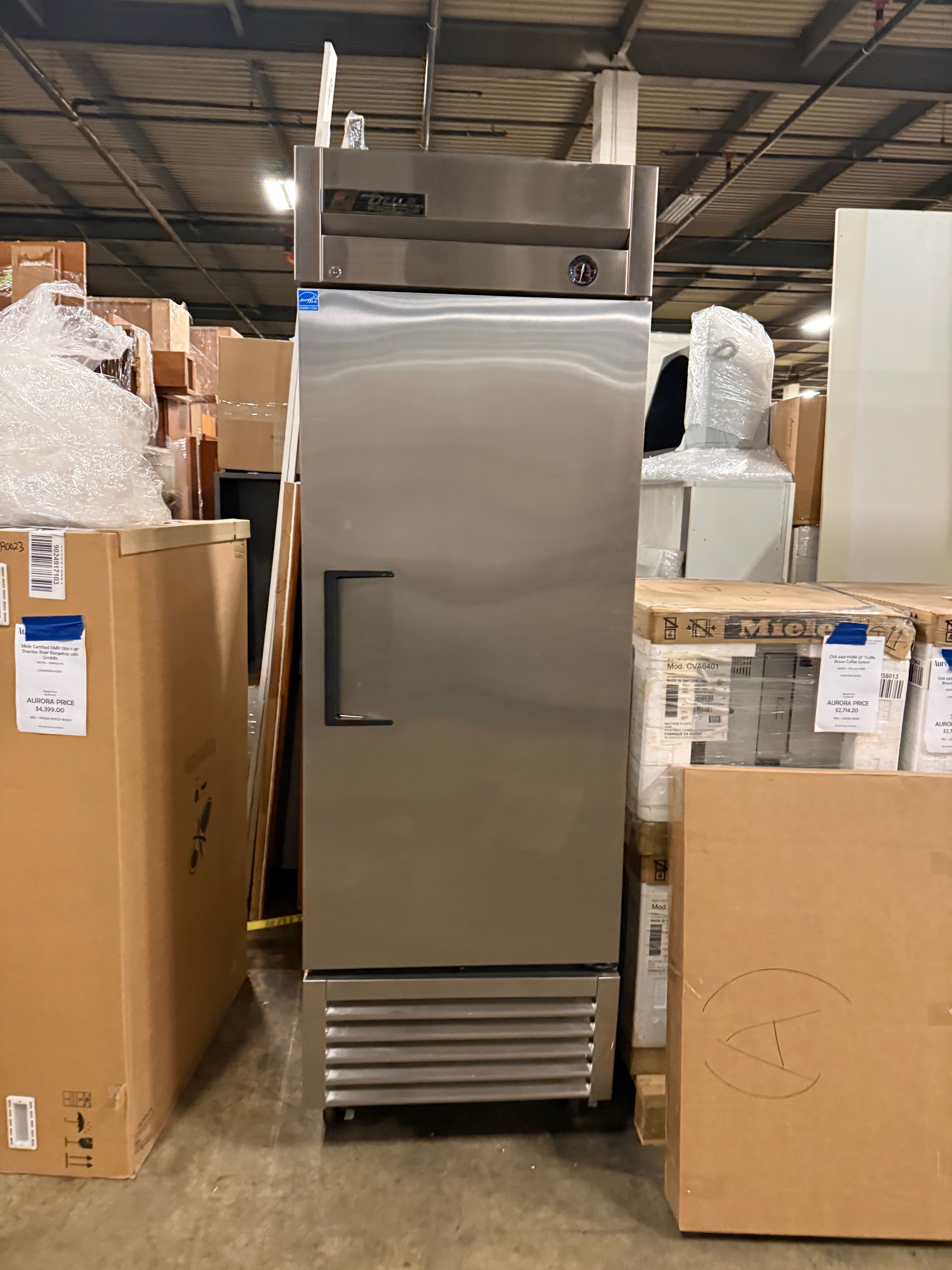 Stainless steel True commercial freezer with bottom-mounted compressor