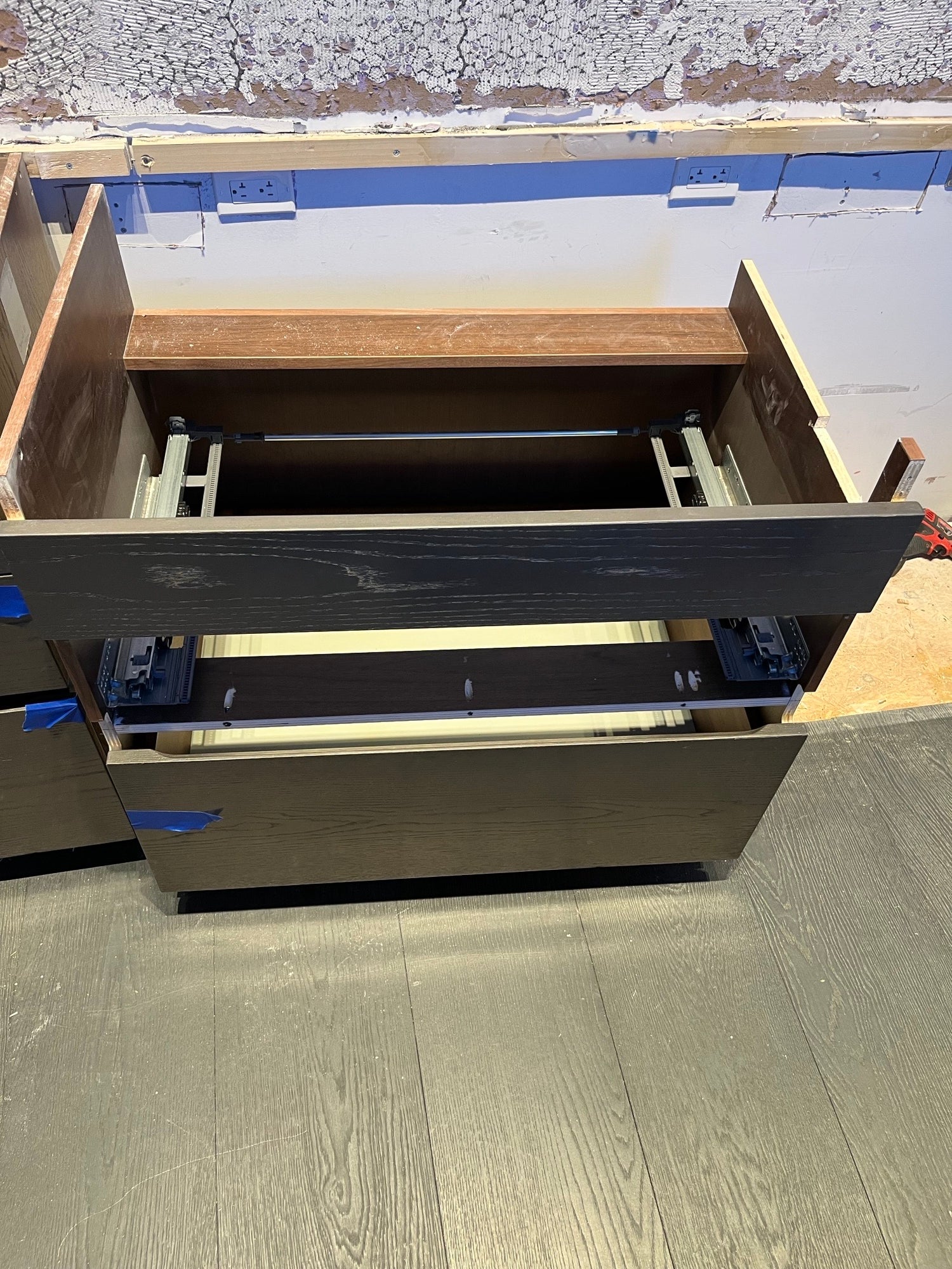 Modern White and Brown Wood Veneer Kitchen with Waterfall Island, Marble Countertops & Miele Appliances