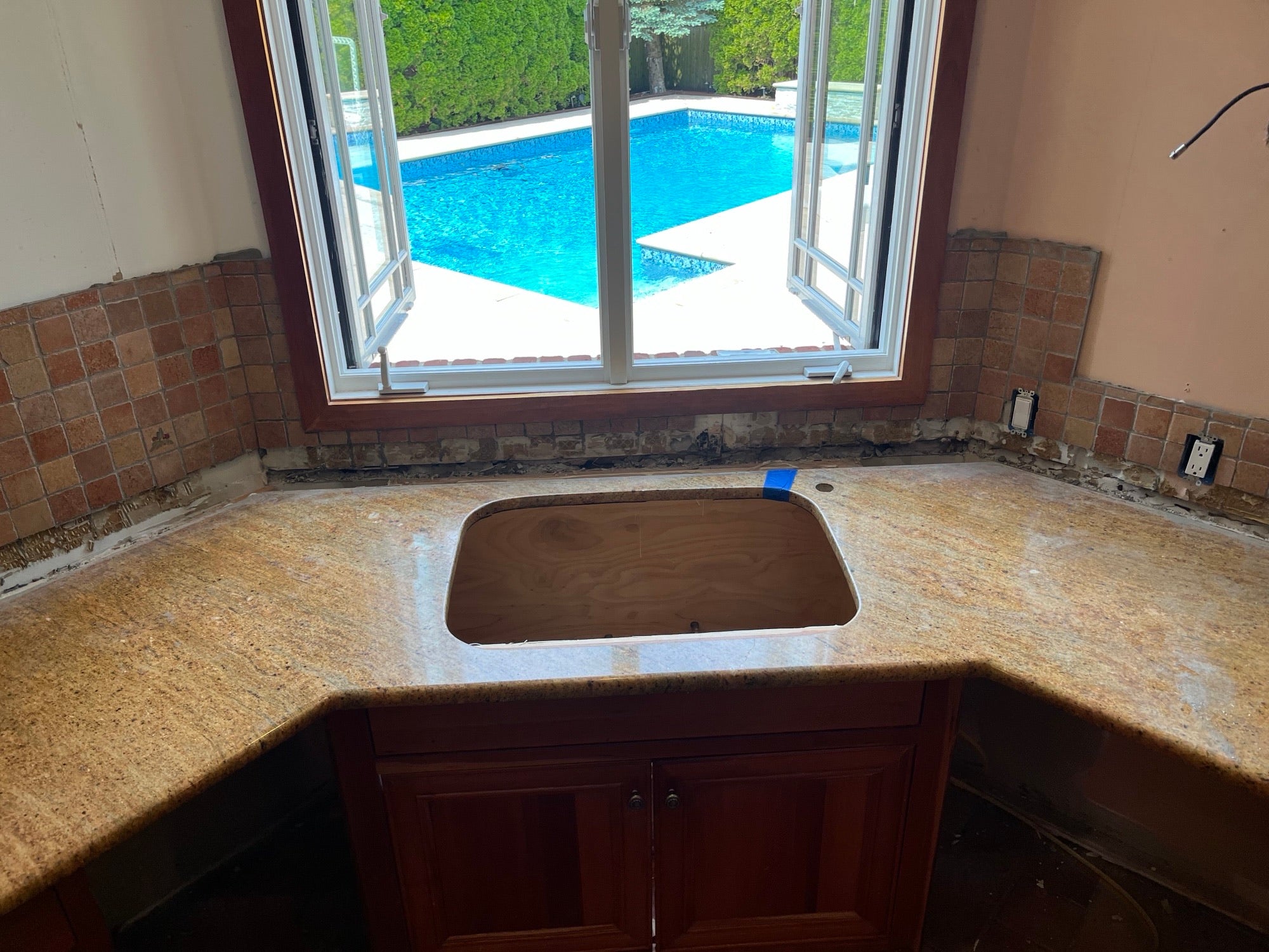 Traditional Wooden Kitchen with Island and Appliances featuring 48" Viking Range