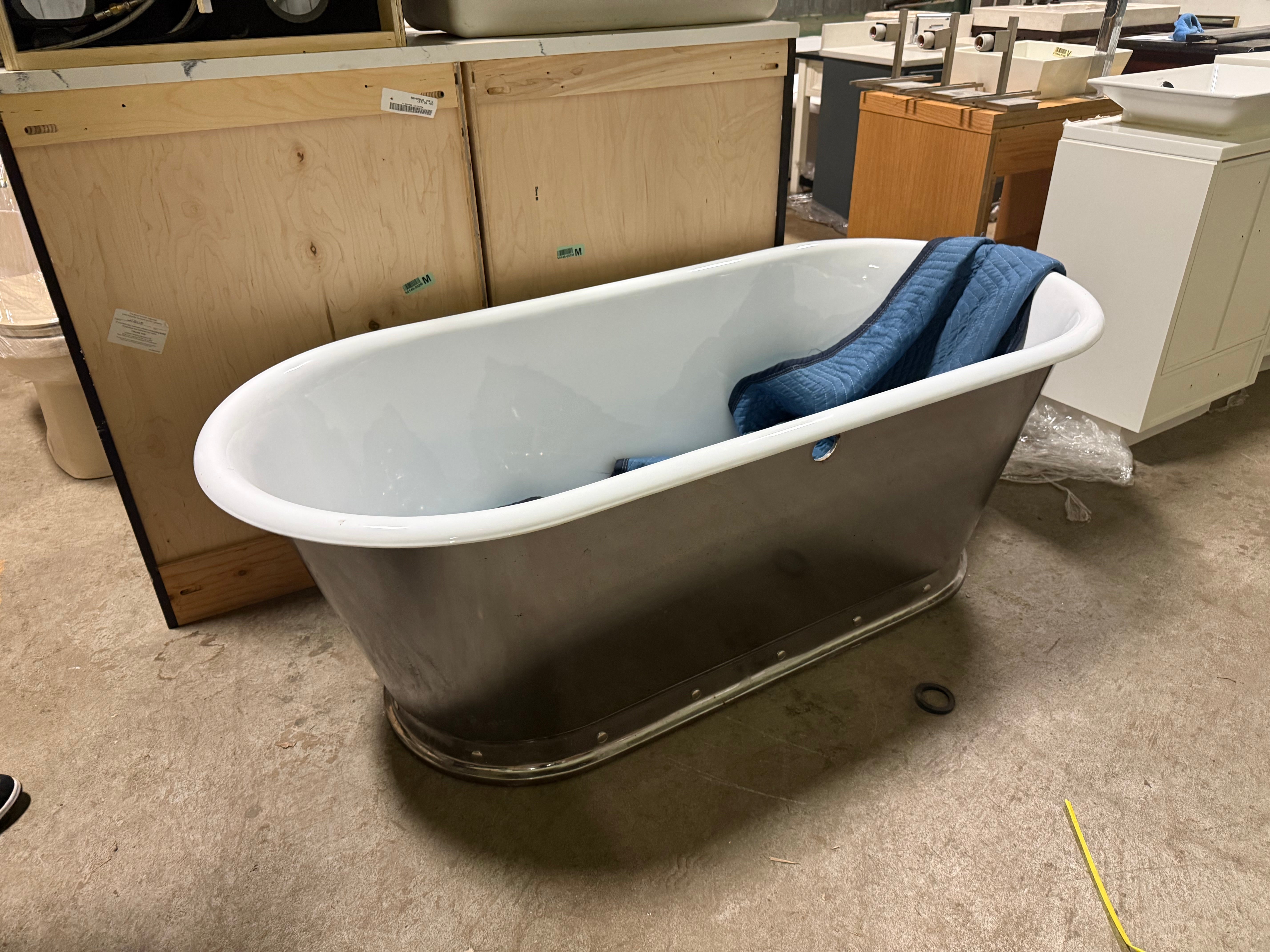 Polished stainless steel 68 inch freestanding soaking tub with matching tub filler