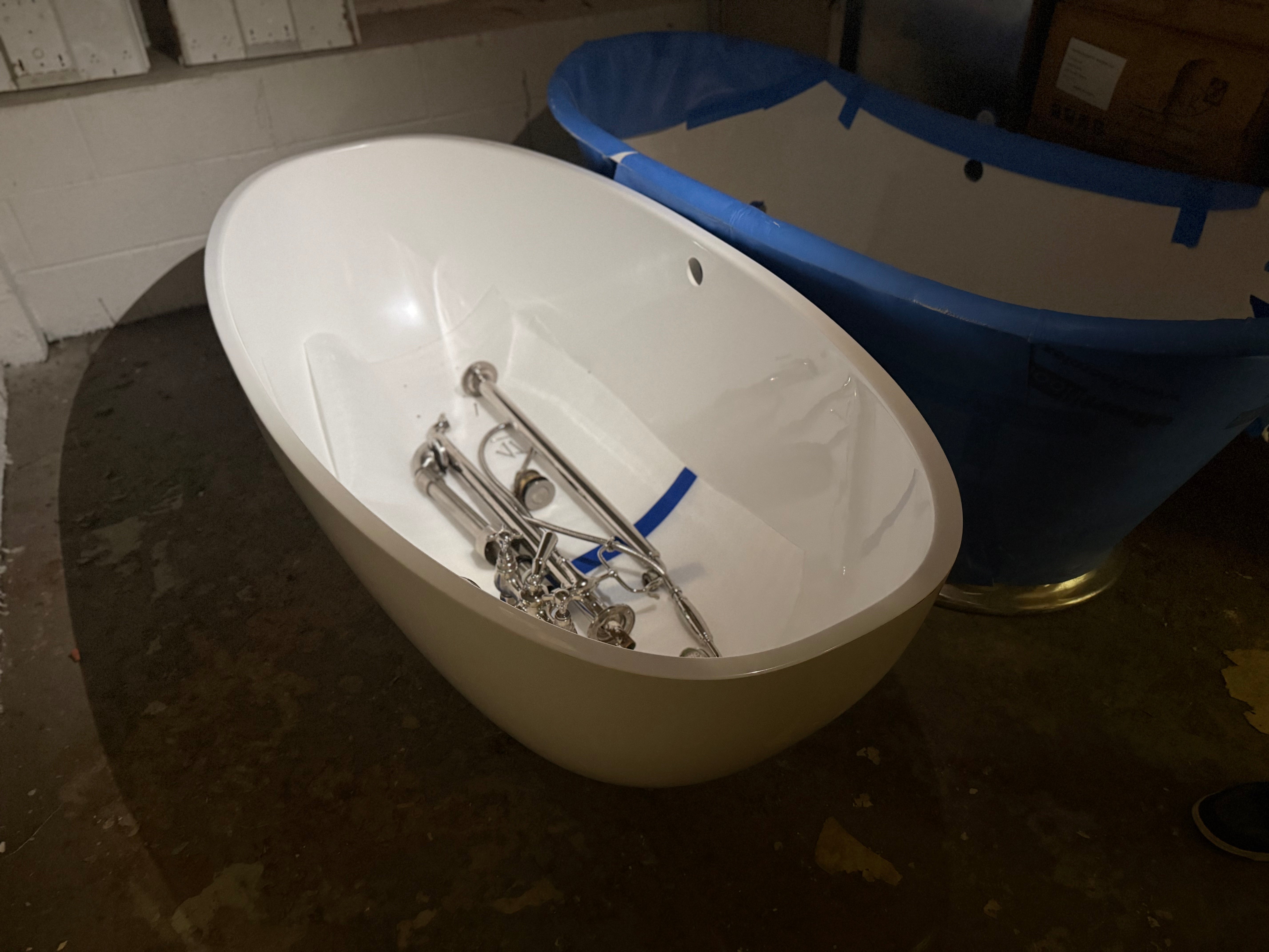 High-end architectural freestanding soaking tub with floor-mounted faucet