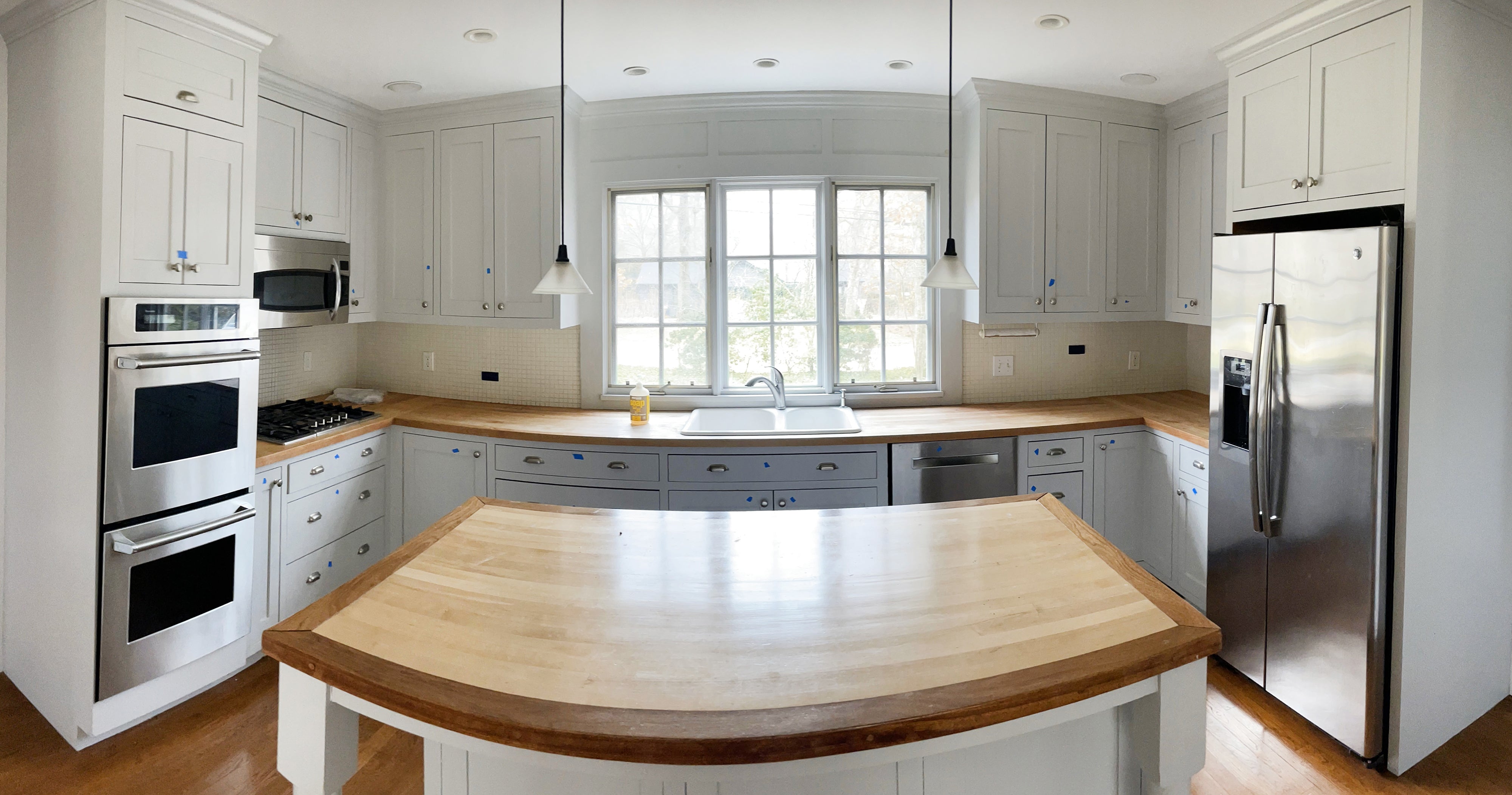 Traditional Grey Kitchen with Island and Wood Countertops