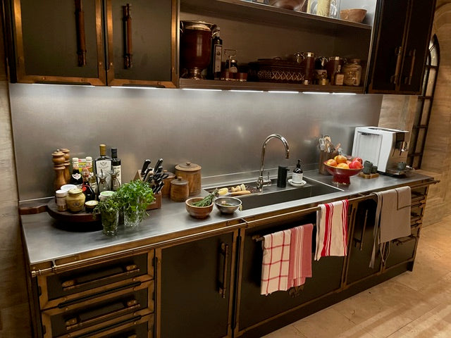 Pre owned Latelier Paris luxury black matte metal cabinetry showing integrated lighting