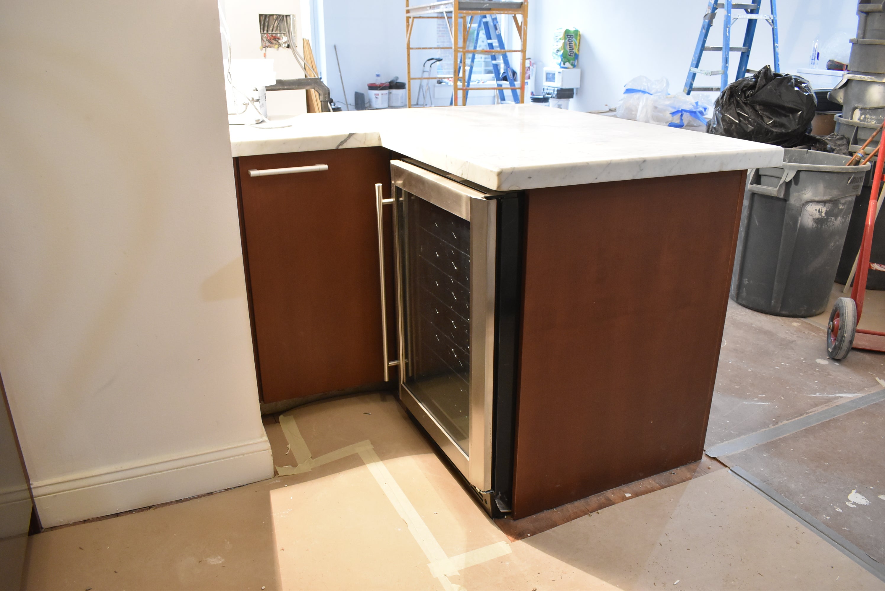 Poggenpohl Brown Toned Transitional Kitchen with Marble Countertops and Appliances