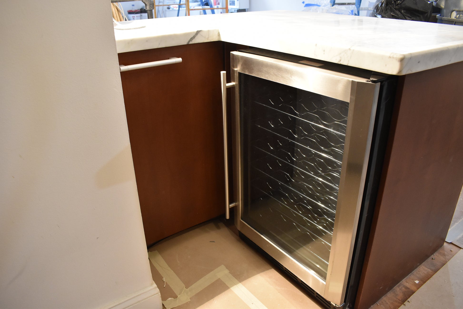 Poggenpohl Brown Toned Transitional Kitchen with Marble Countertops and Appliances
