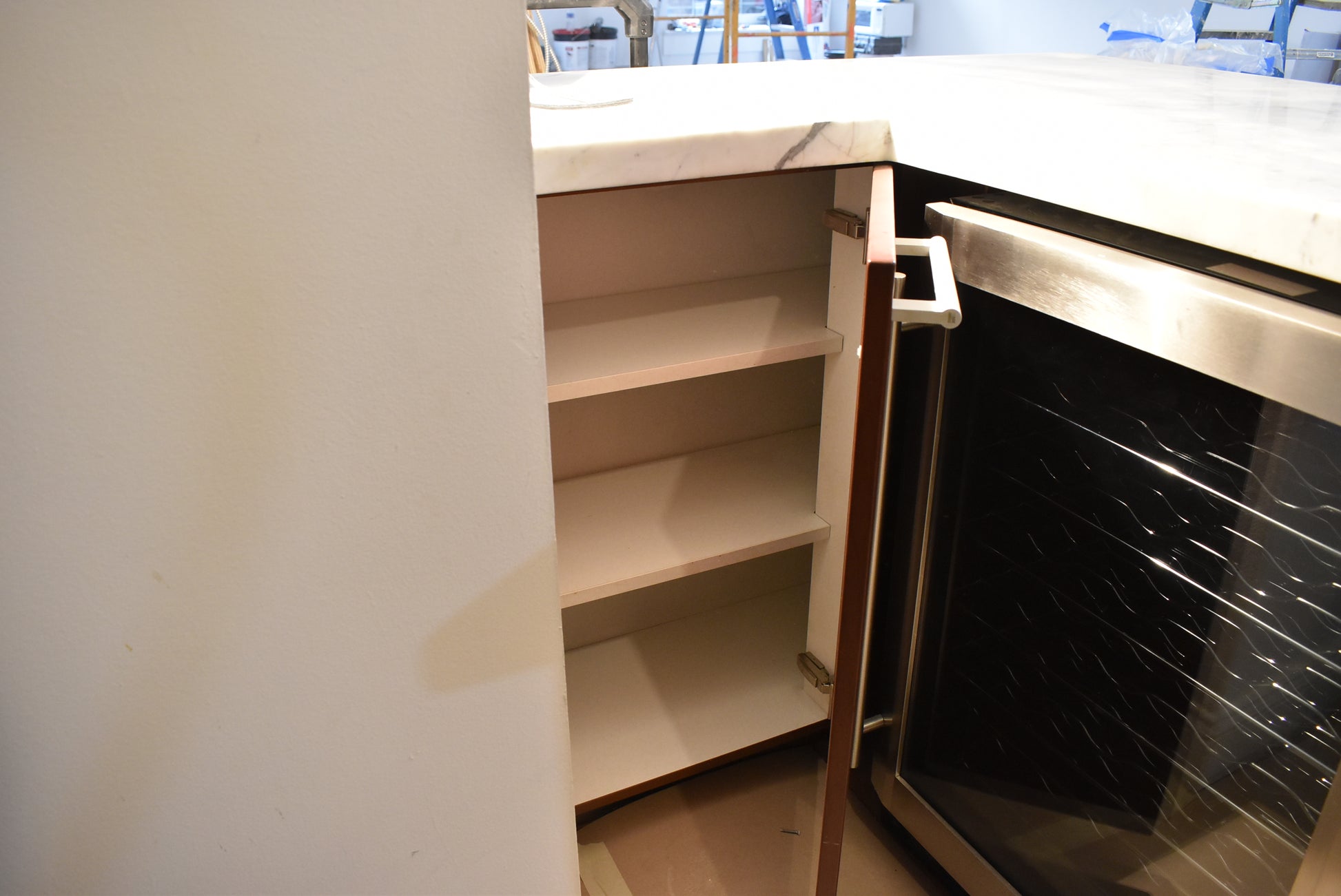 Poggenpohl Brown Toned Transitional Kitchen with Marble Countertops and Appliances