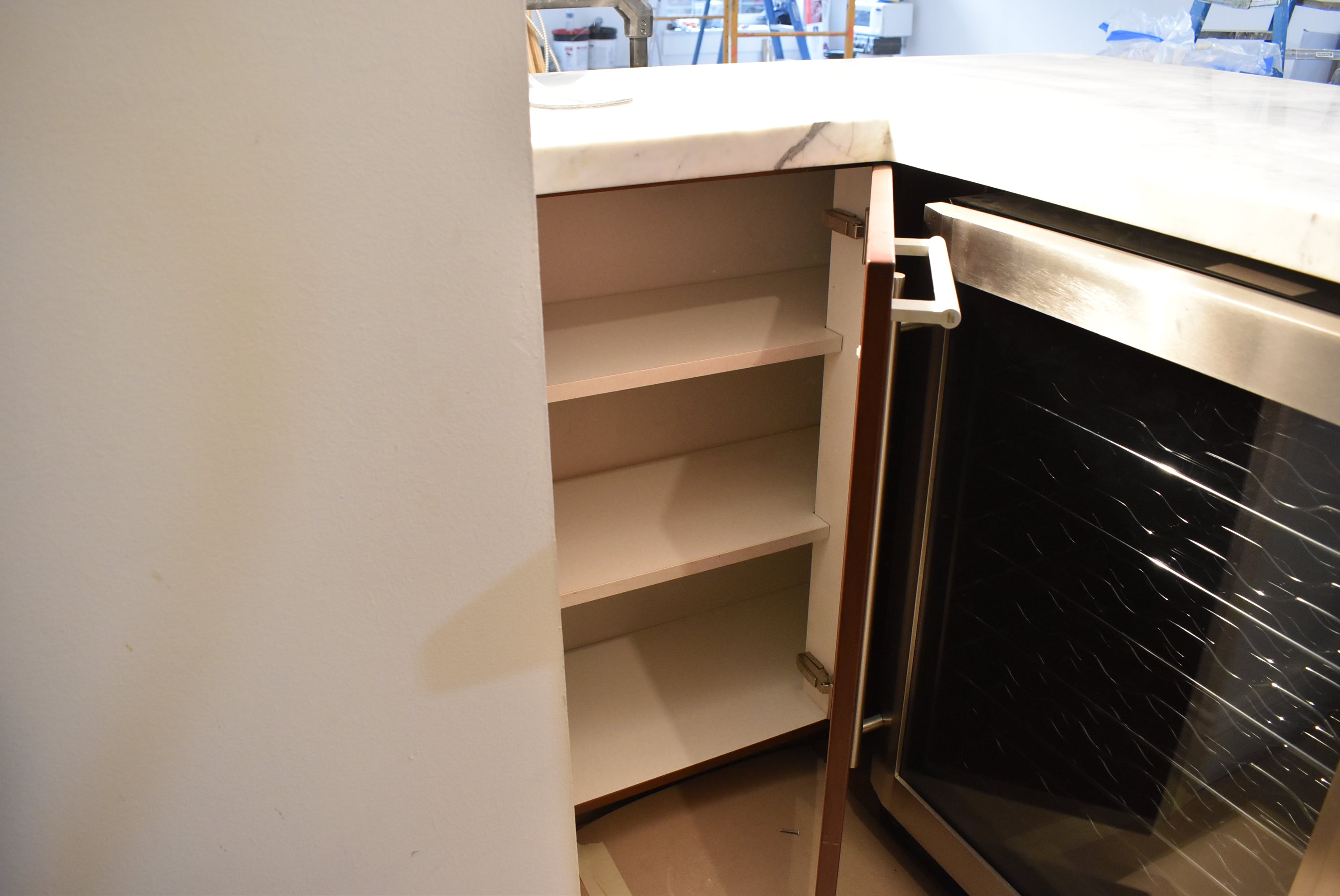 Poggenpohl Brown Toned Transitional Kitchen with Marble Countertops and Appliances