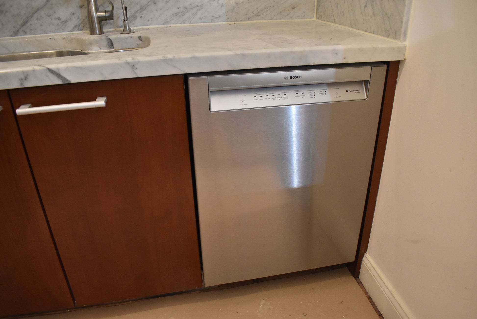 Poggenpohl Brown Toned Transitional Kitchen with Marble Countertops and Appliances