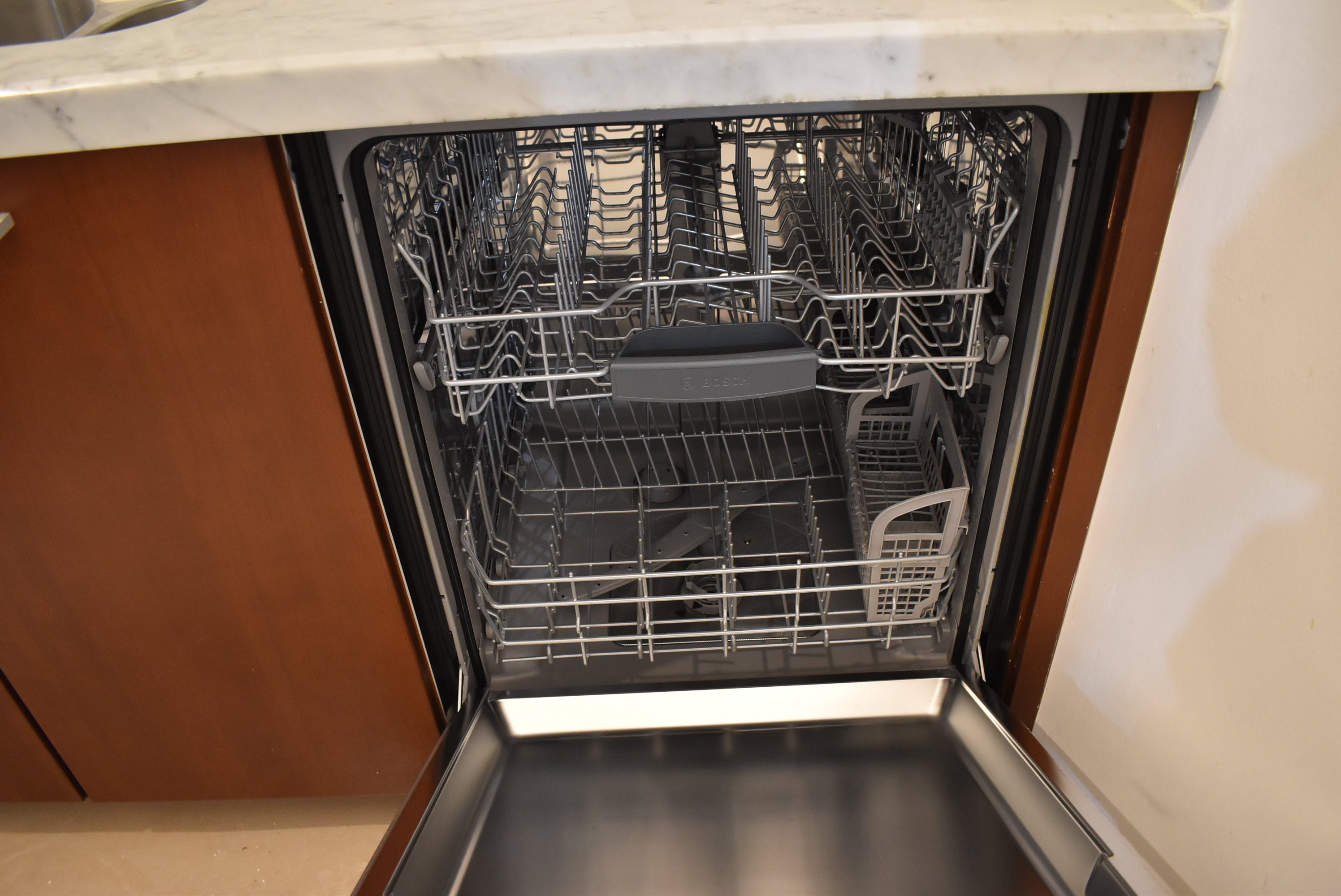Poggenpohl Brown Toned Transitional Kitchen with Marble Countertops and Appliances