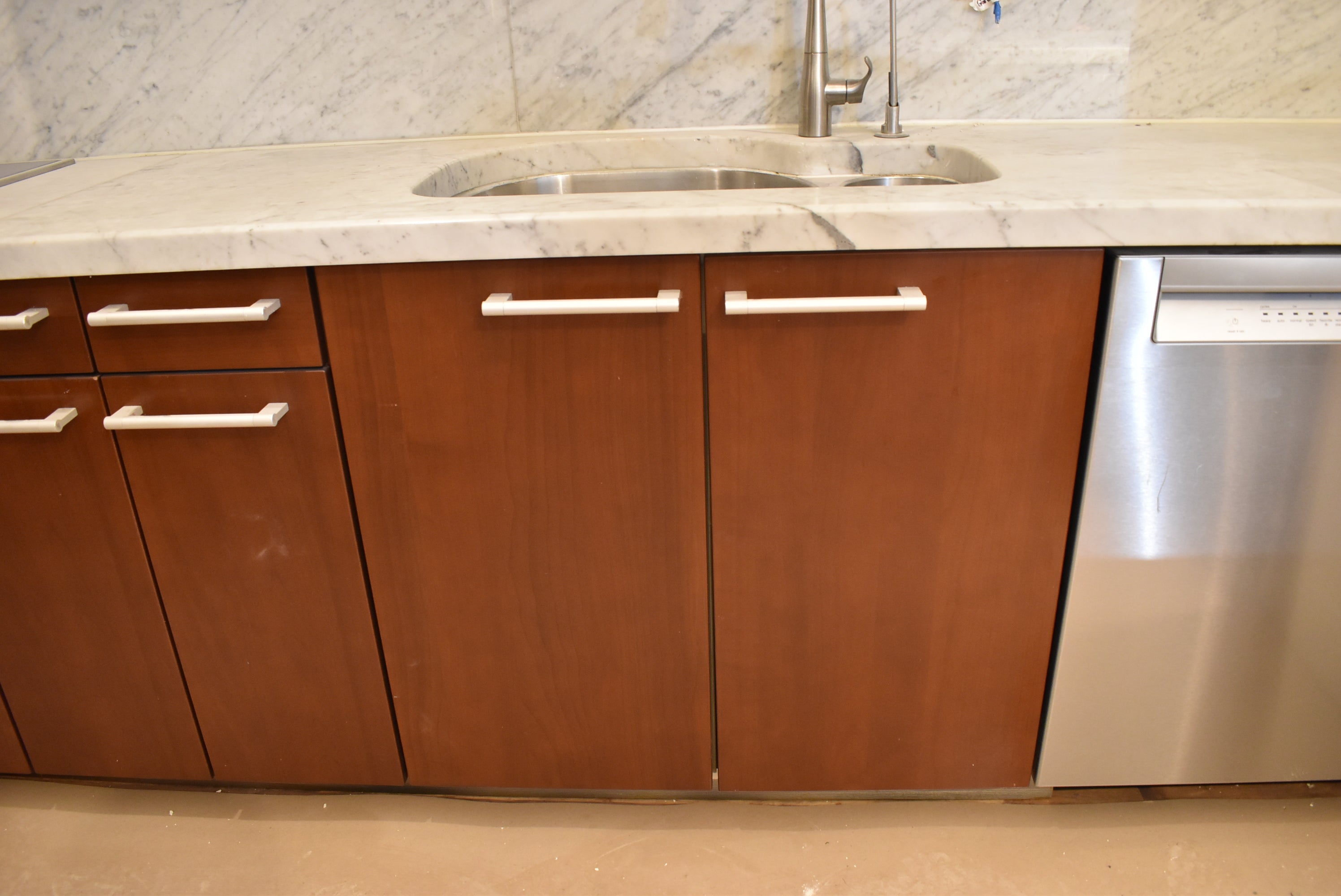 Poggenpohl Brown Toned Transitional Kitchen with Marble Countertops and Appliances