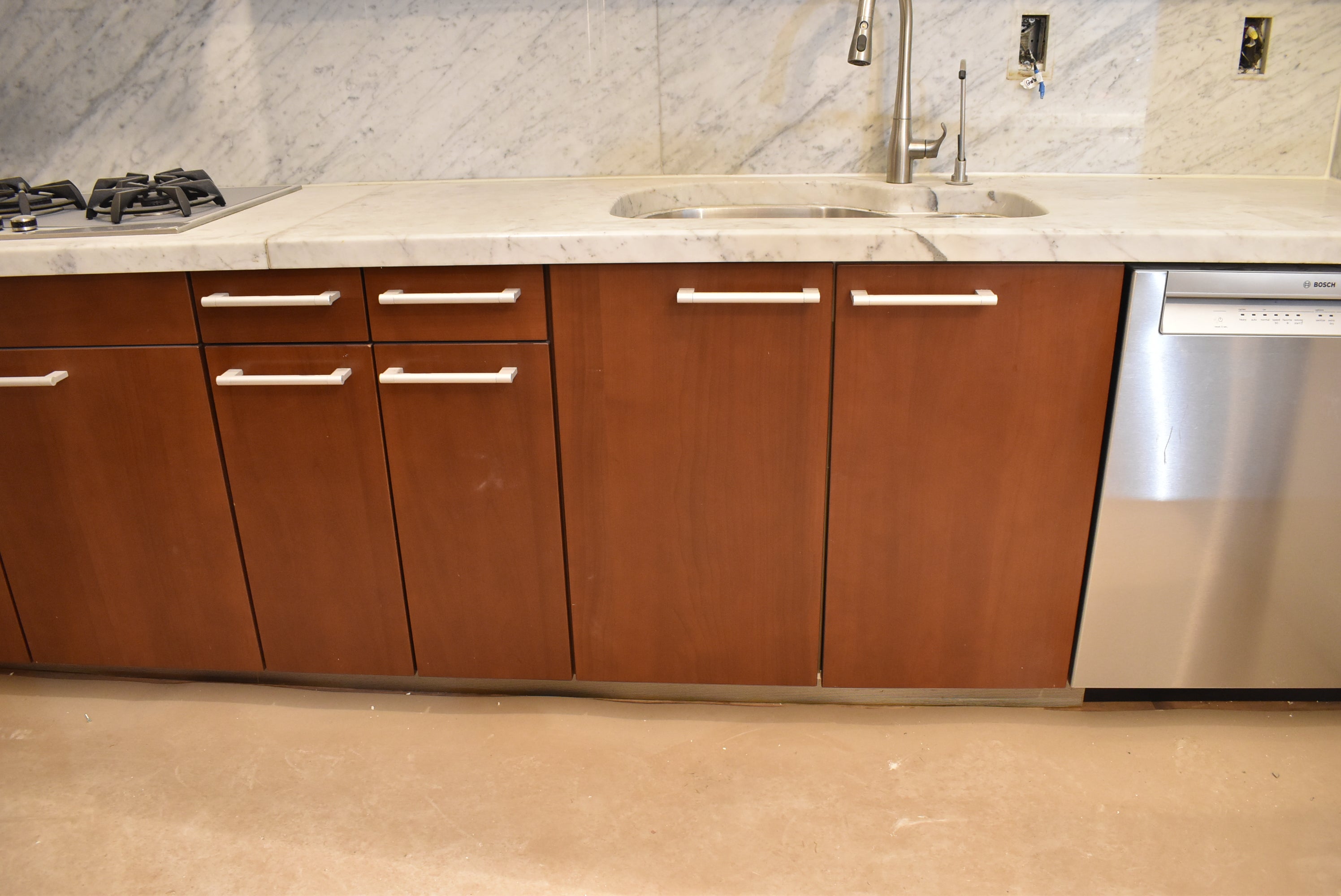 Poggenpohl Brown Toned Transitional Kitchen with Marble Countertops and Appliances