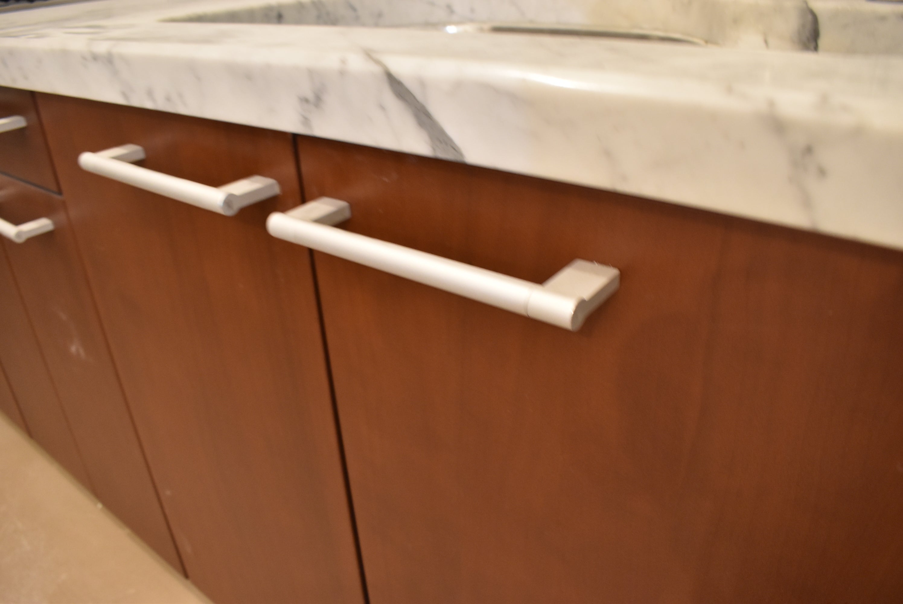 Poggenpohl Brown Toned Transitional Kitchen with Marble Countertops and Appliances