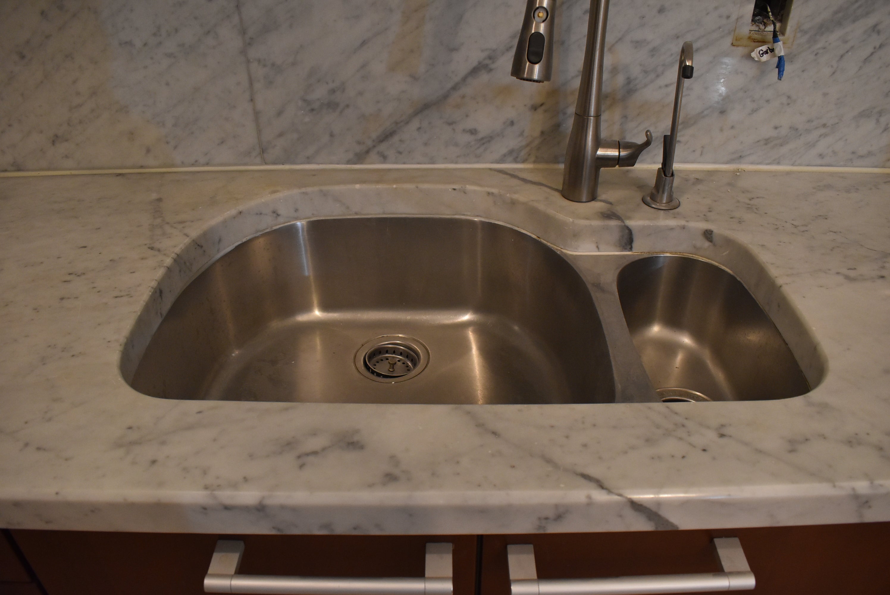 Poggenpohl Brown Toned Transitional Kitchen with Marble Countertops and Appliances