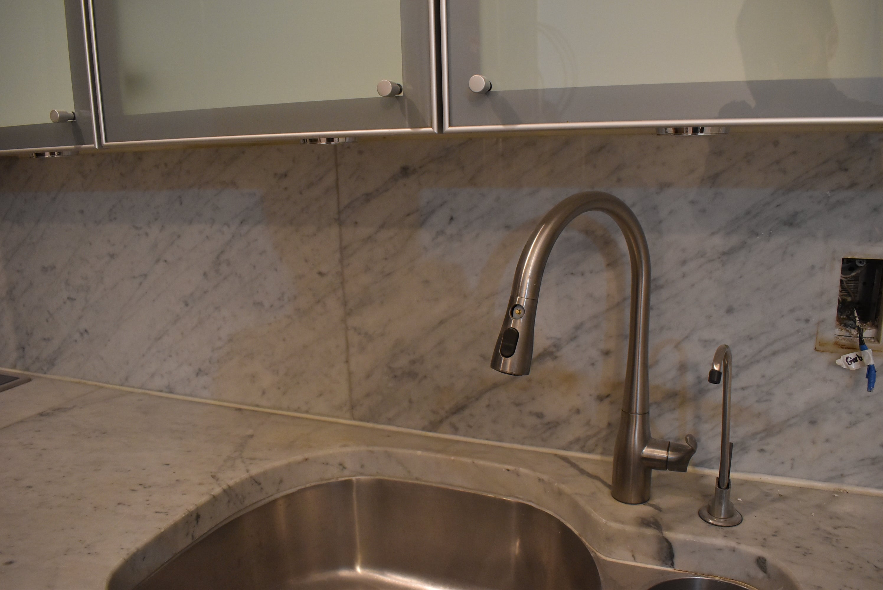 Poggenpohl Brown Toned Transitional Kitchen with Marble Countertops and Appliances