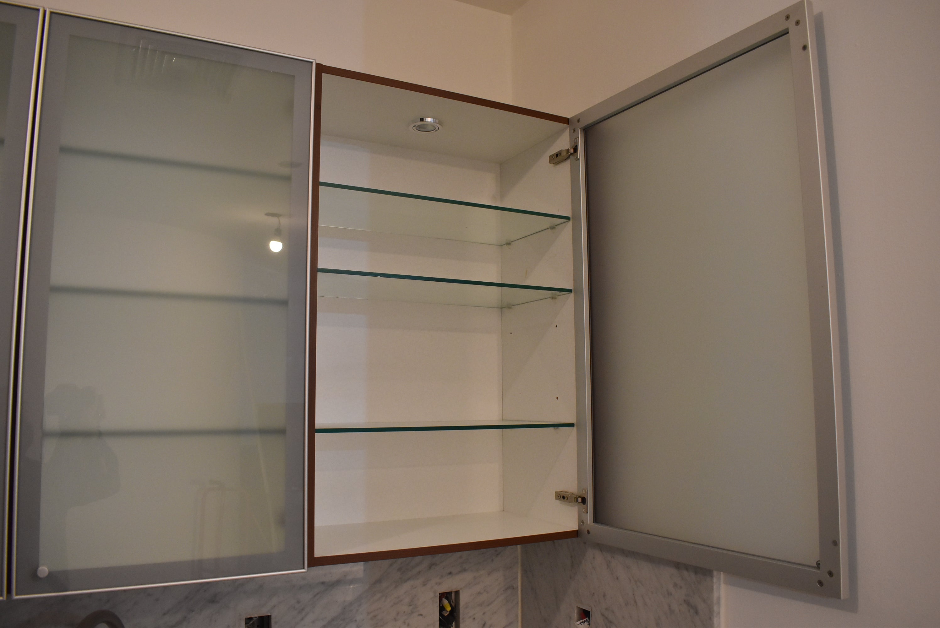 Poggenpohl Brown Toned Transitional Kitchen with Marble Countertops and Appliances