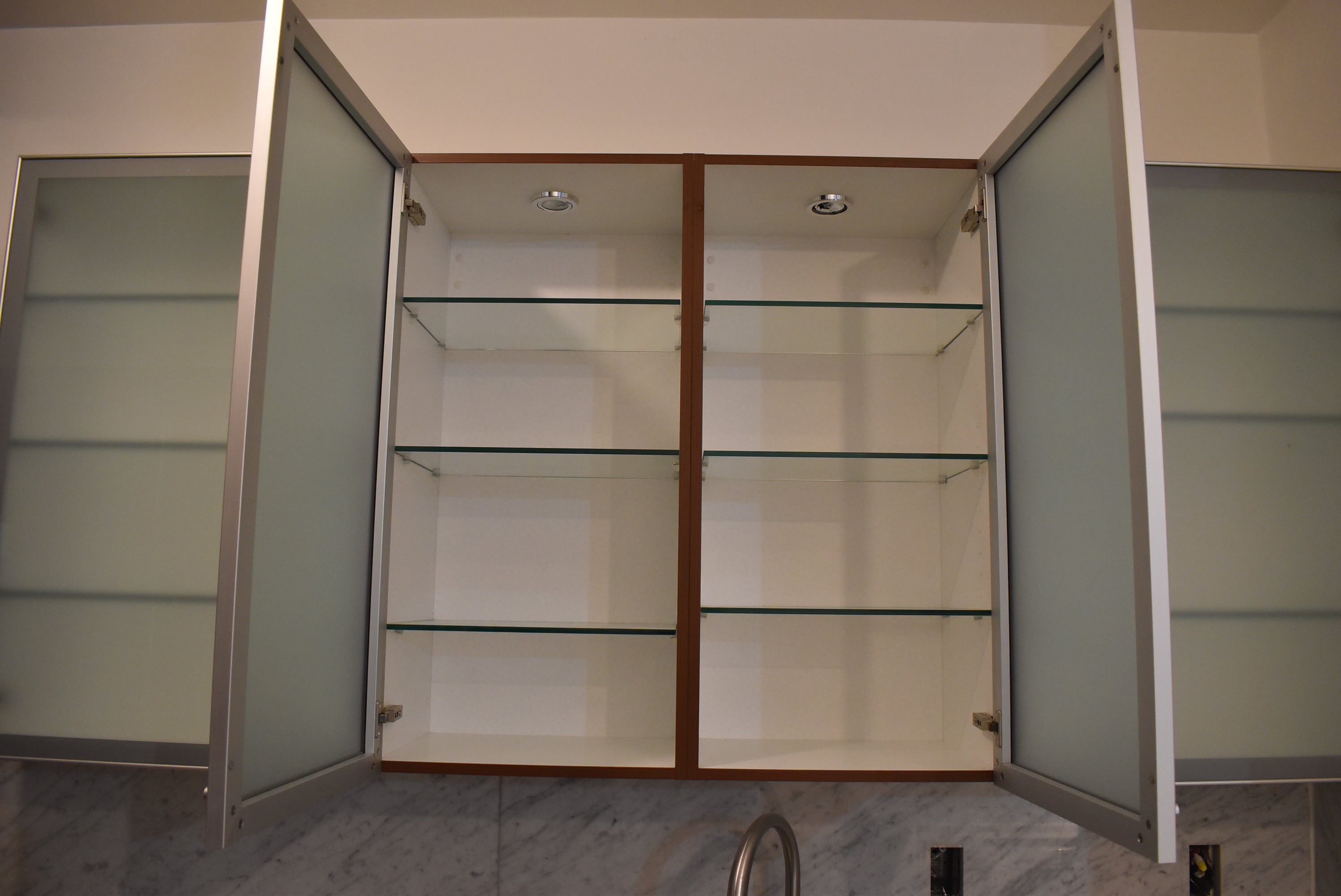 Poggenpohl Brown Toned Transitional Kitchen with Marble Countertops and Appliances