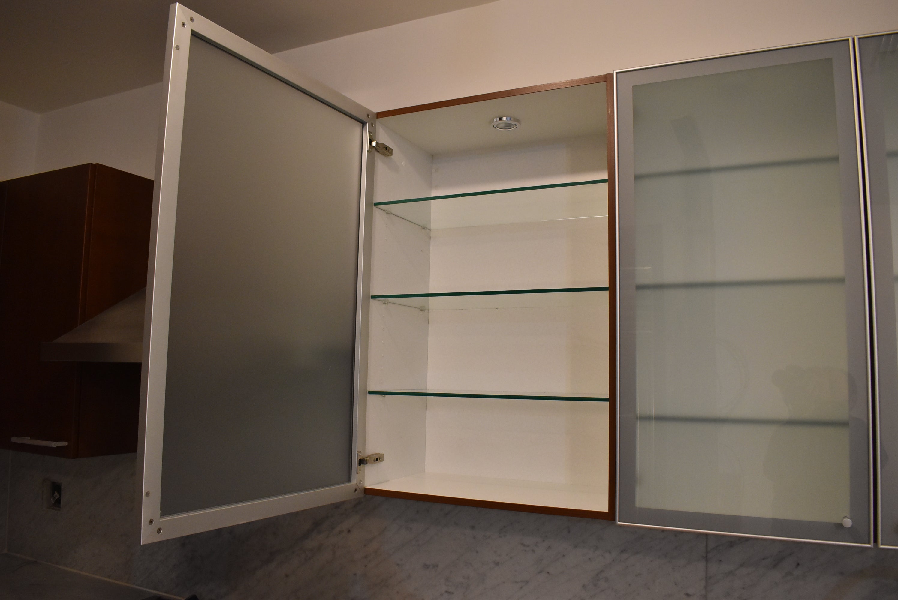 Poggenpohl Brown Toned Transitional Kitchen with Marble Countertops and Appliances