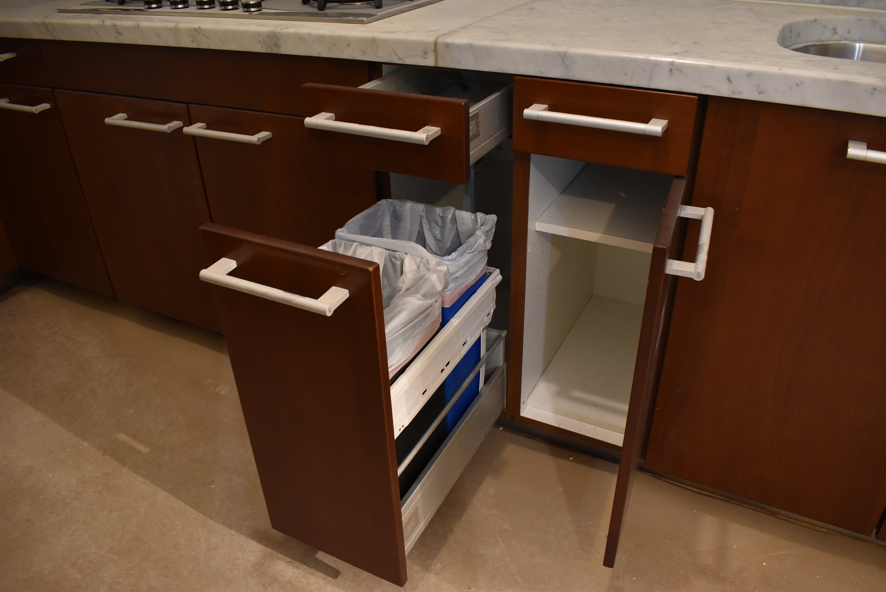 Poggenpohl Brown Toned Transitional Kitchen with Marble Countertops and Appliances