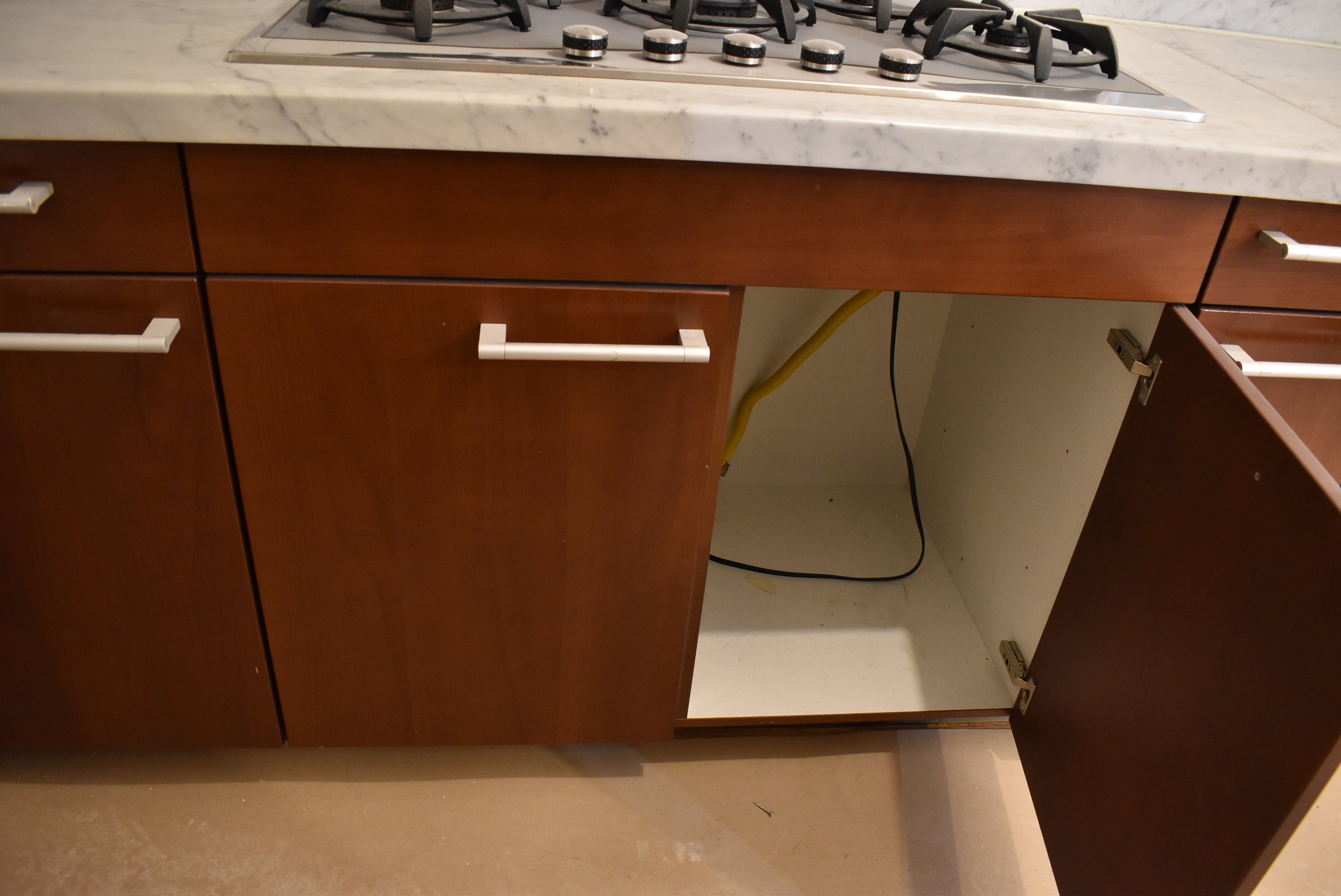 Poggenpohl Brown Toned Transitional Kitchen with Marble Countertops and Appliances