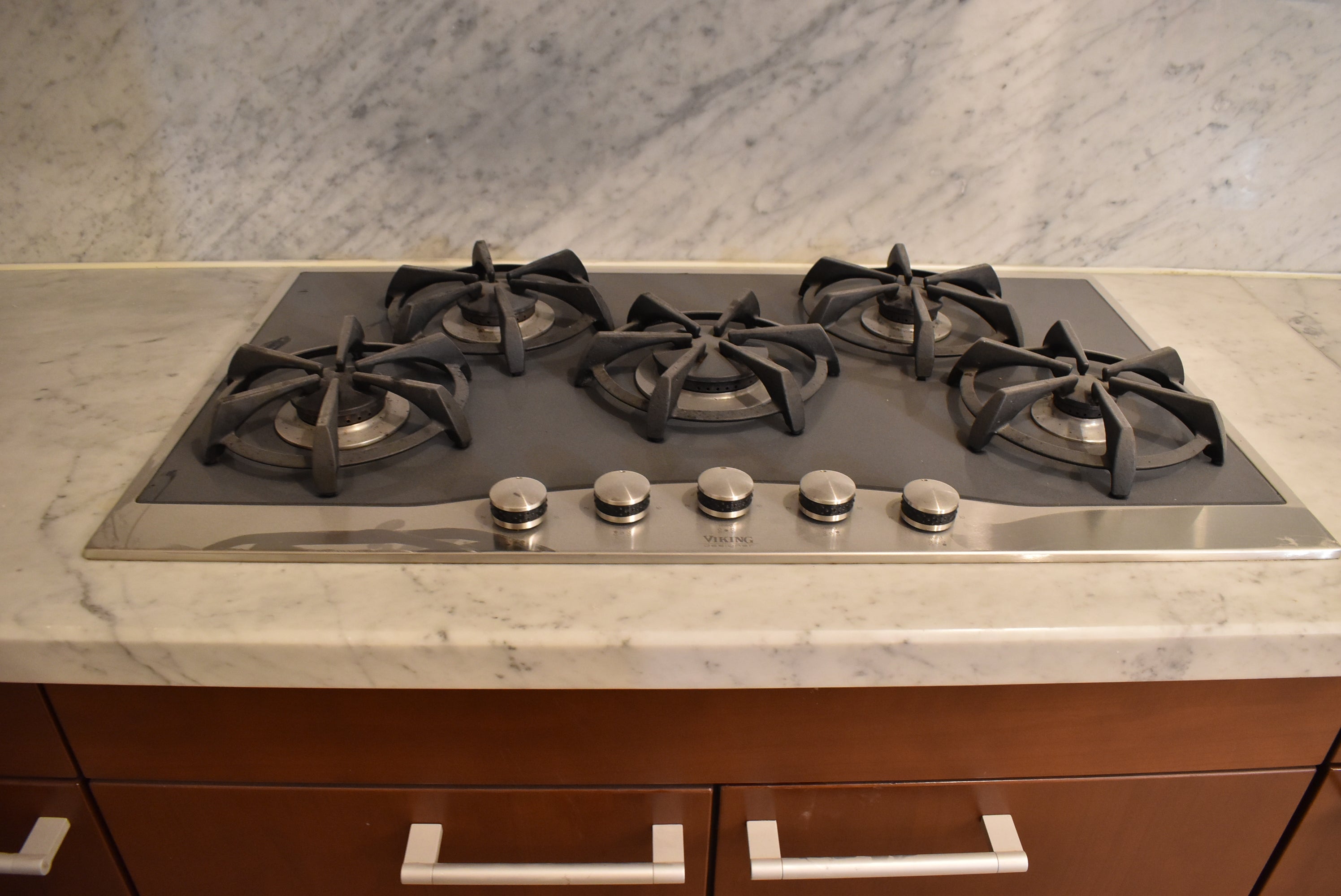 Poggenpohl Brown Toned Transitional Kitchen with Marble Countertops and Appliances