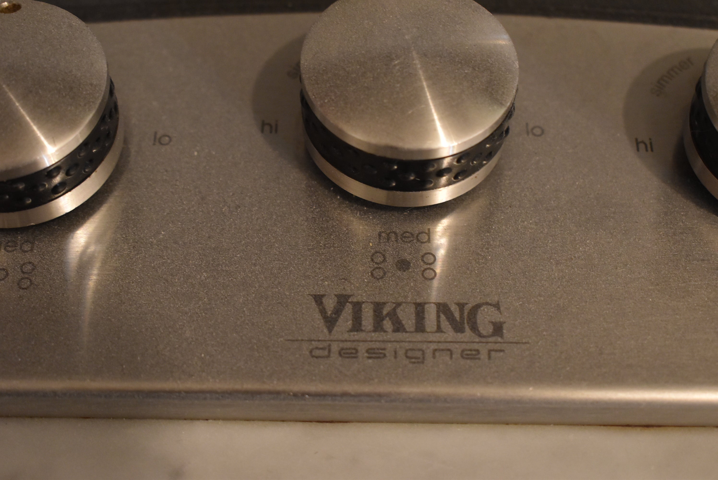 Poggenpohl Brown Toned Transitional Kitchen with Marble Countertops and Appliances