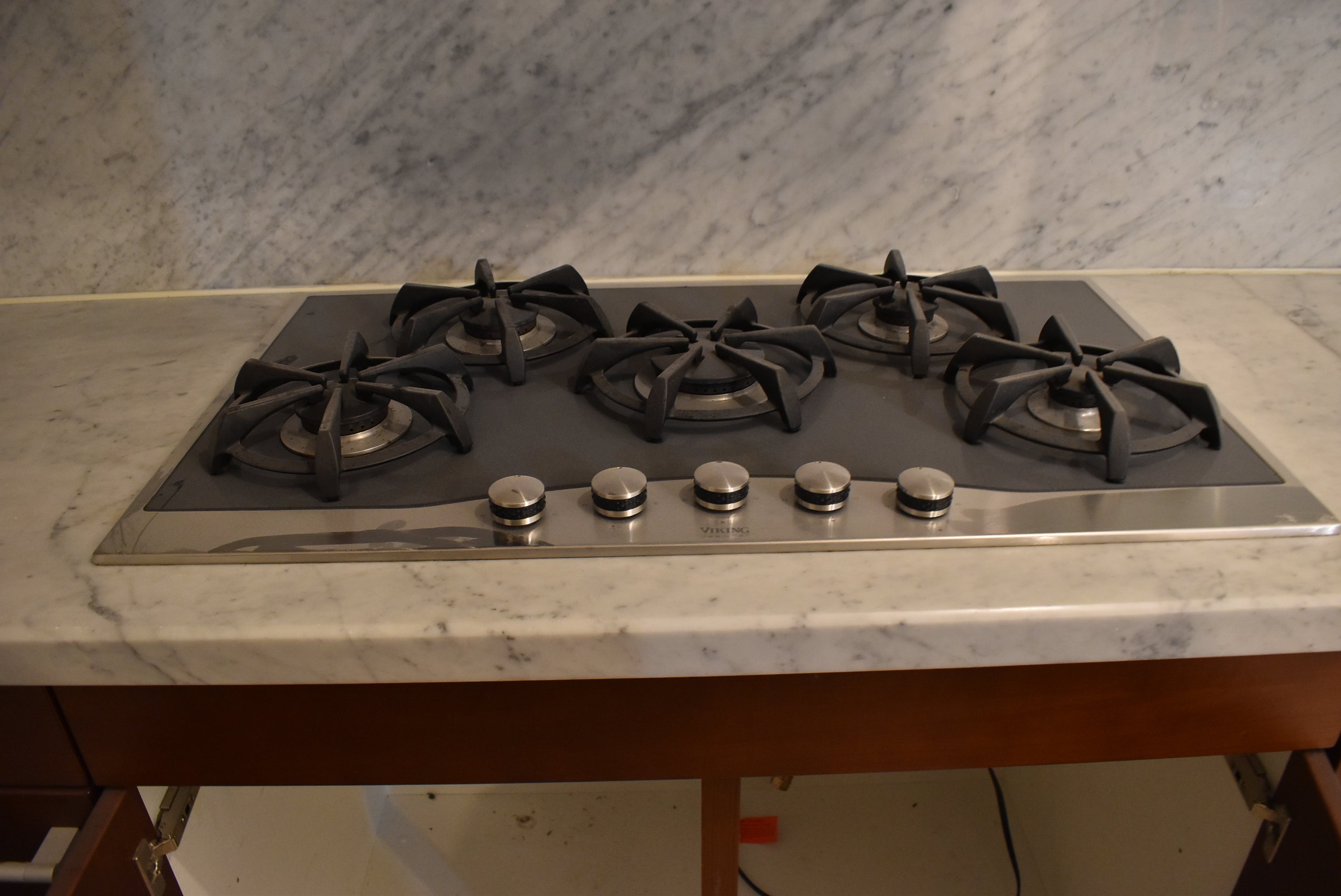 Poggenpohl Brown Toned Transitional Kitchen with Marble Countertops and Appliances