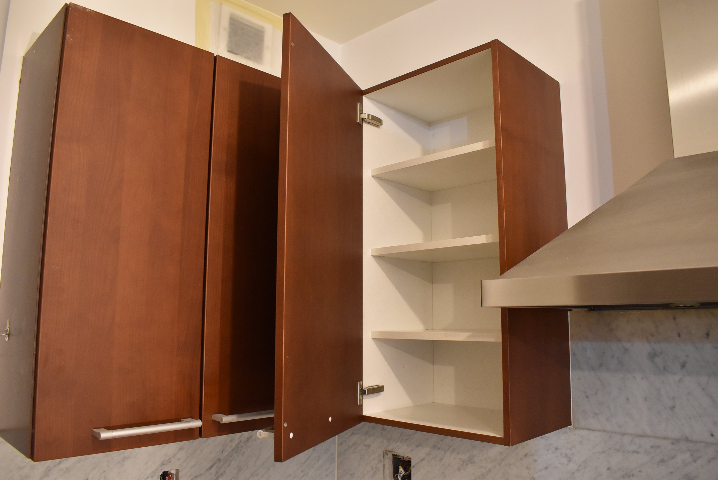 Poggenpohl Brown Toned Transitional Kitchen with Marble Countertops and Appliances