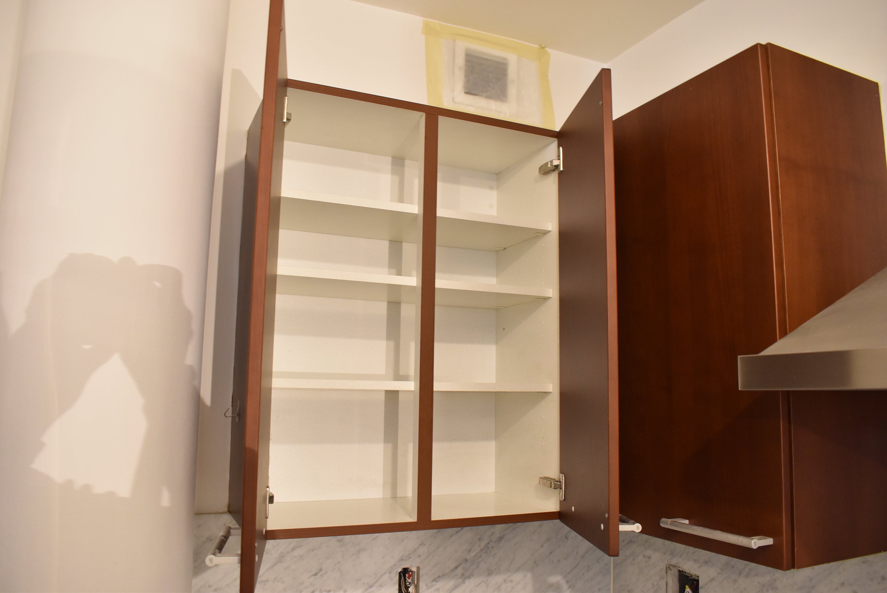 Poggenpohl Brown Toned Transitional Kitchen with Marble Countertops and Appliances