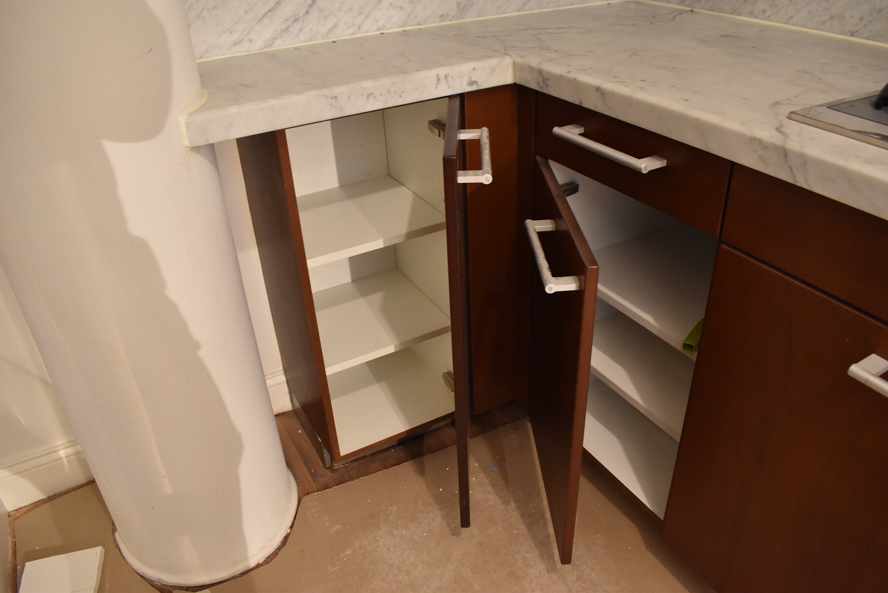 Poggenpohl Brown Toned Transitional Kitchen with Marble Countertops and Appliances