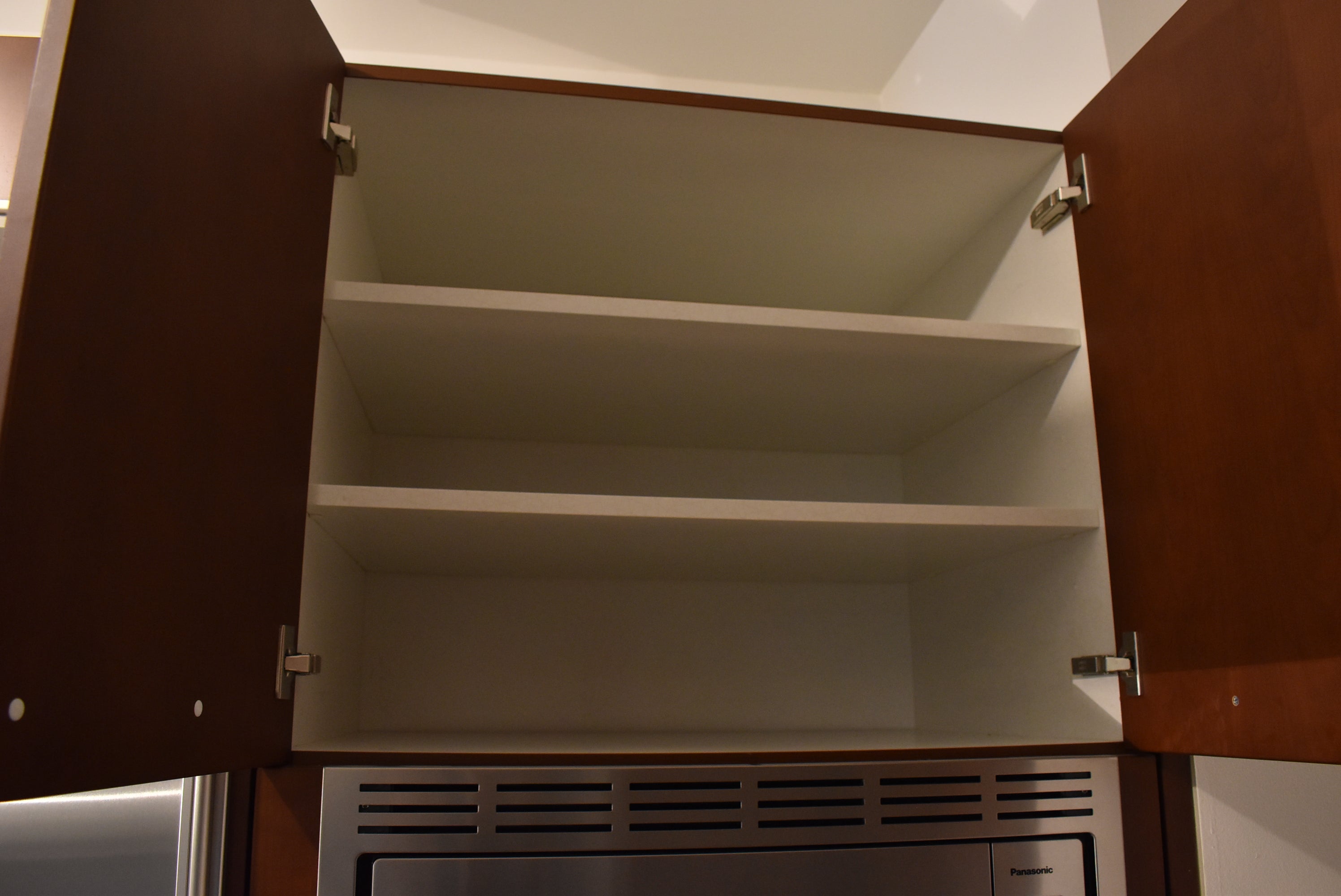 Poggenpohl Brown Toned Transitional Kitchen with Marble Countertops and Appliances