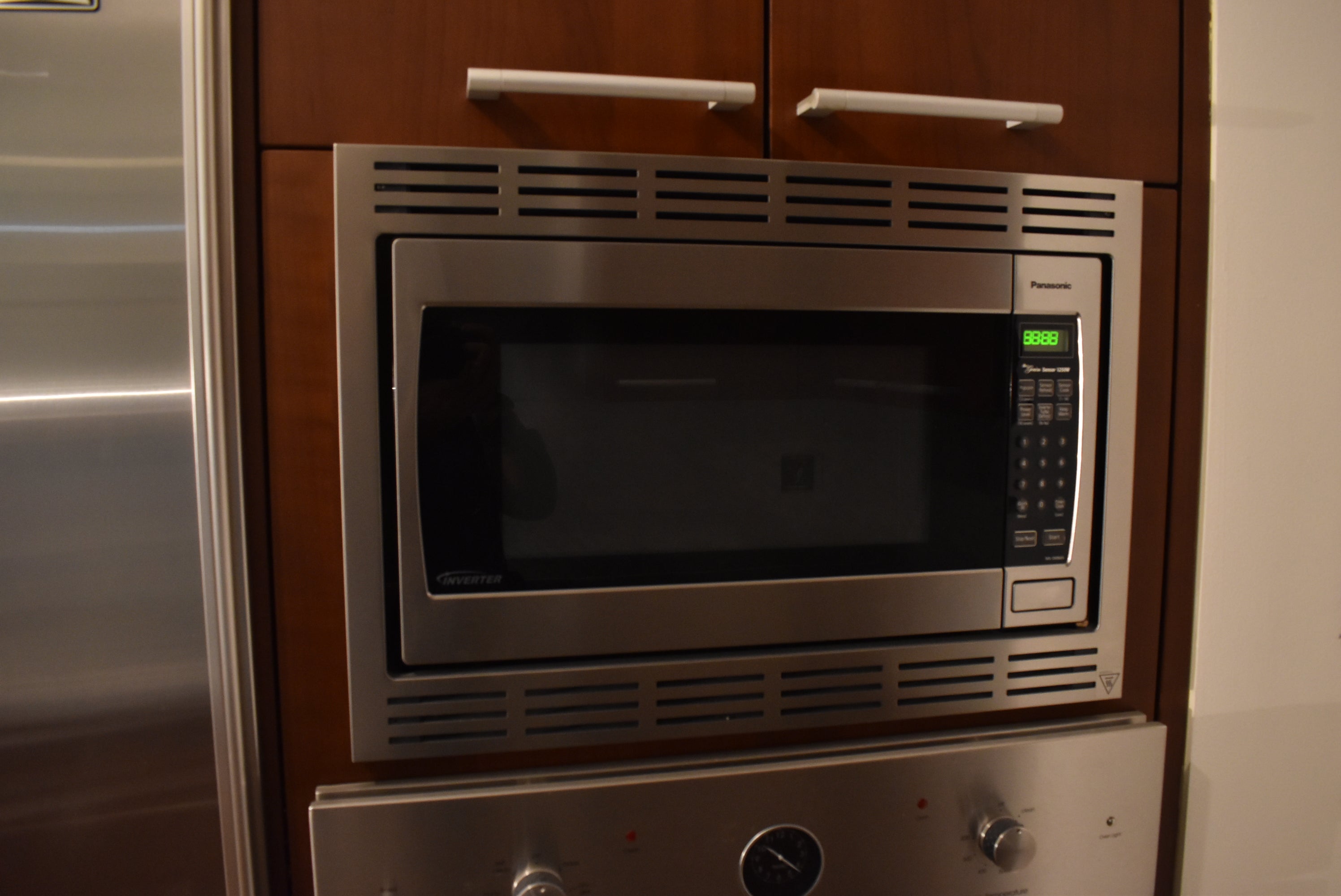 Poggenpohl Brown Toned Transitional Kitchen with Marble Countertops and Appliances