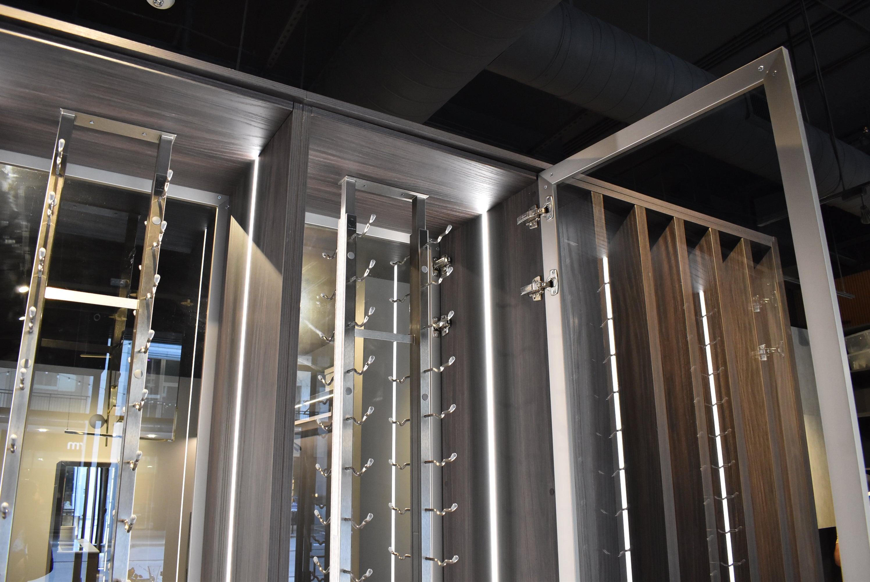 Azzurri Casa Modern Wood Paneled Wet Wine Bar with Wine Wall and Onyx Countertops