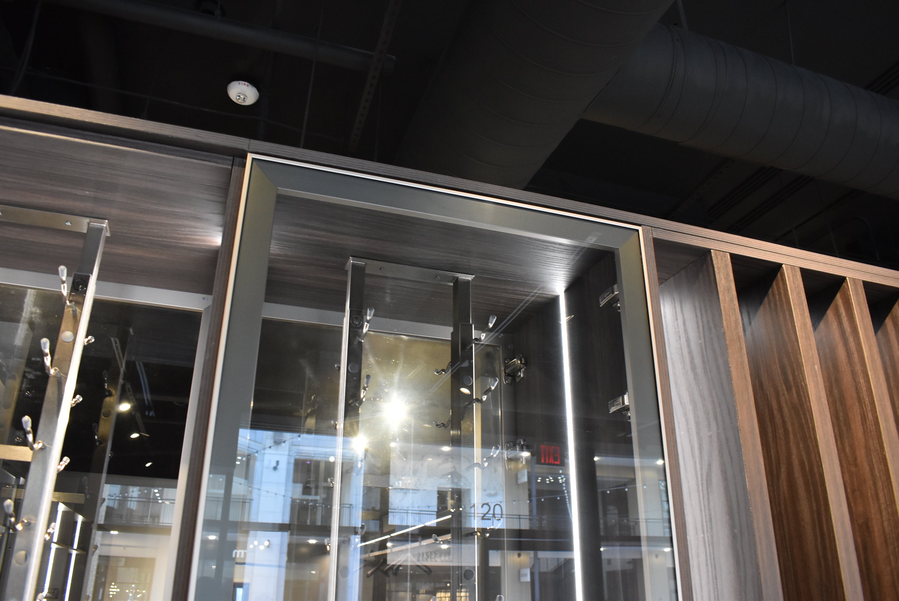 Azzurri Casa Modern Wood Paneled Wet Wine Bar with Wine Wall and Onyx Countertops