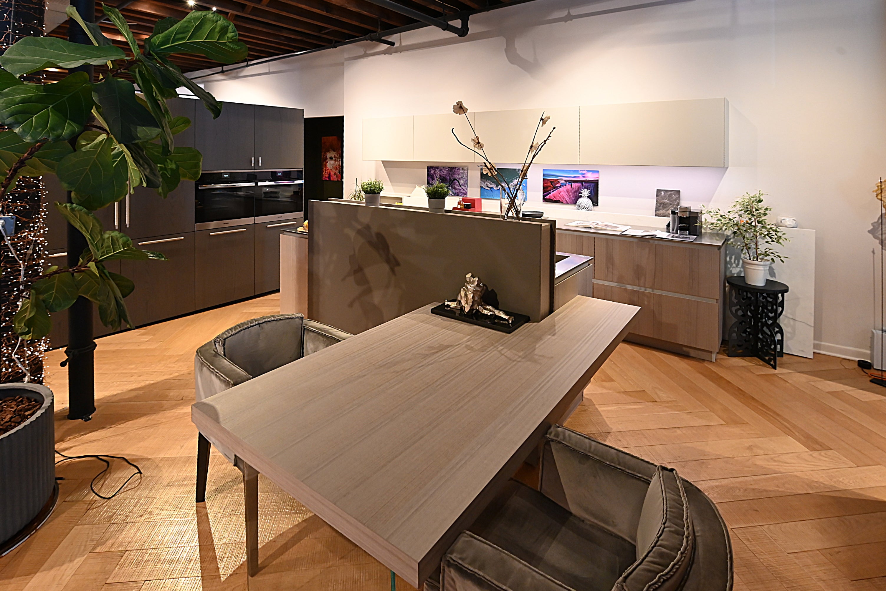 Close up view of the seamless handleless gray cabinet drawers and deep black composite worktop on a Copatlife kitchen island
