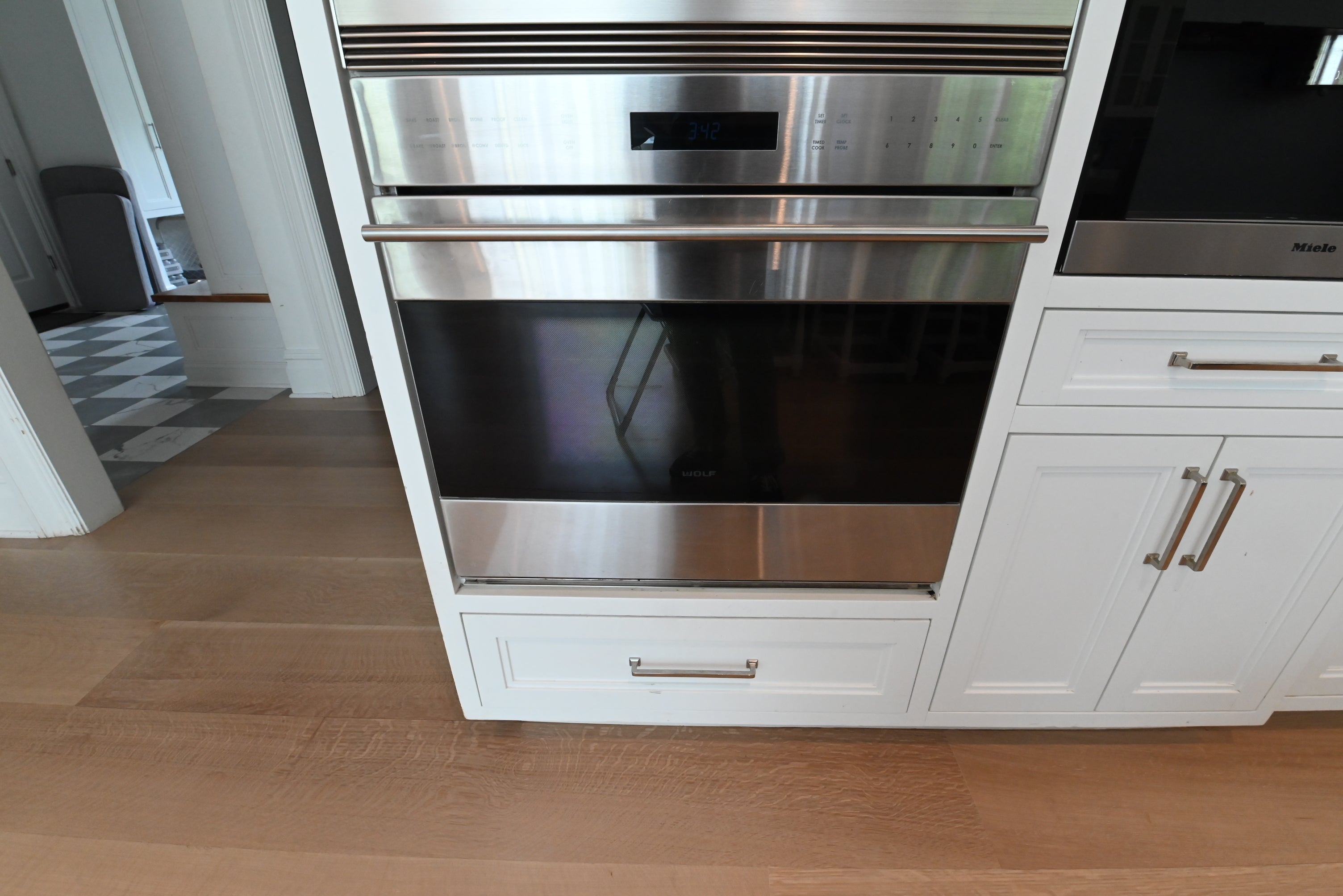 "The Abercorn" Transitional White Kitchen with Island & 48" Wolf Range