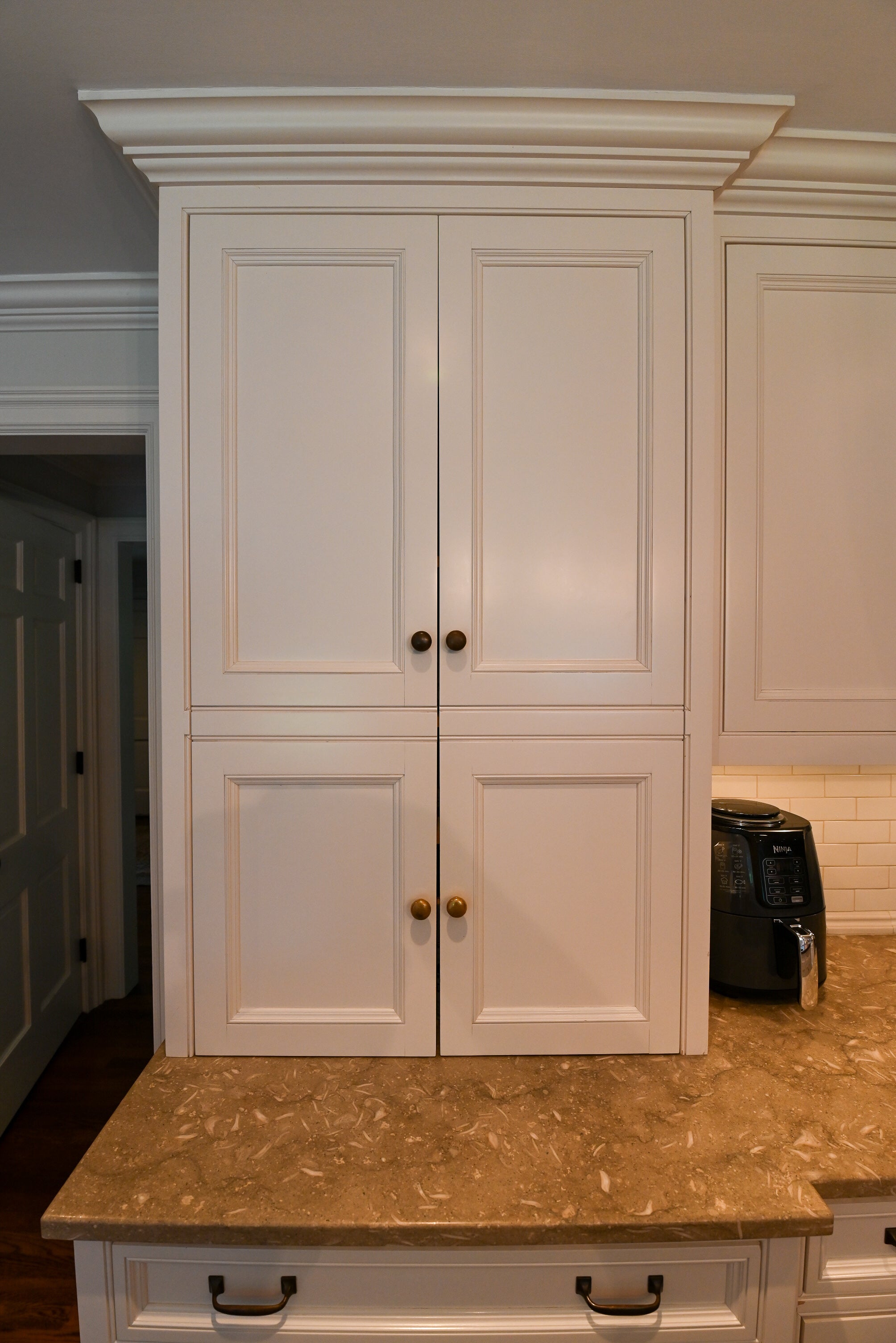 "The Montclair" Transitional White Kitchen with Island & Wolf 48" Range