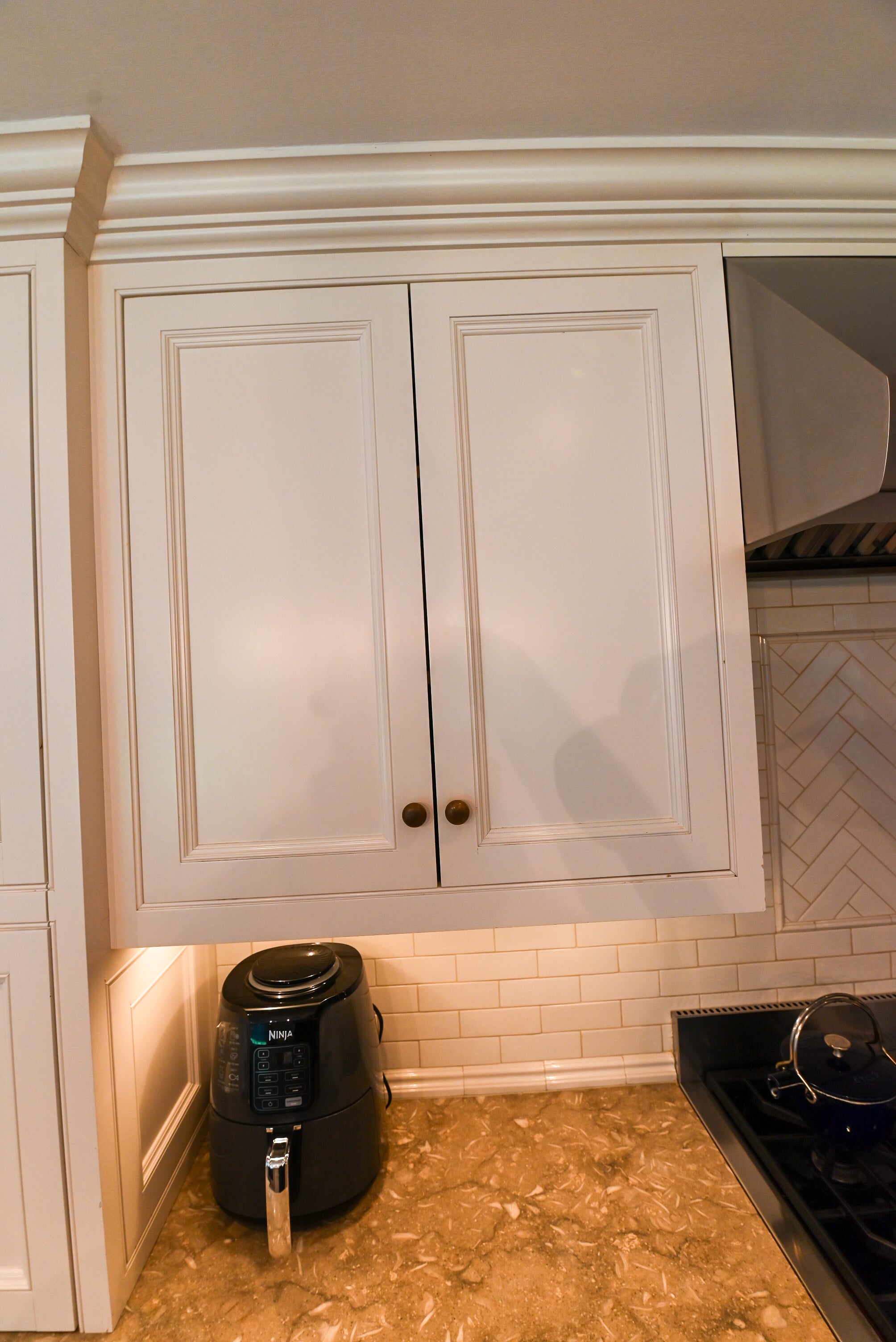 "The Montclair" Transitional White Kitchen with Island & Wolf 48" Range