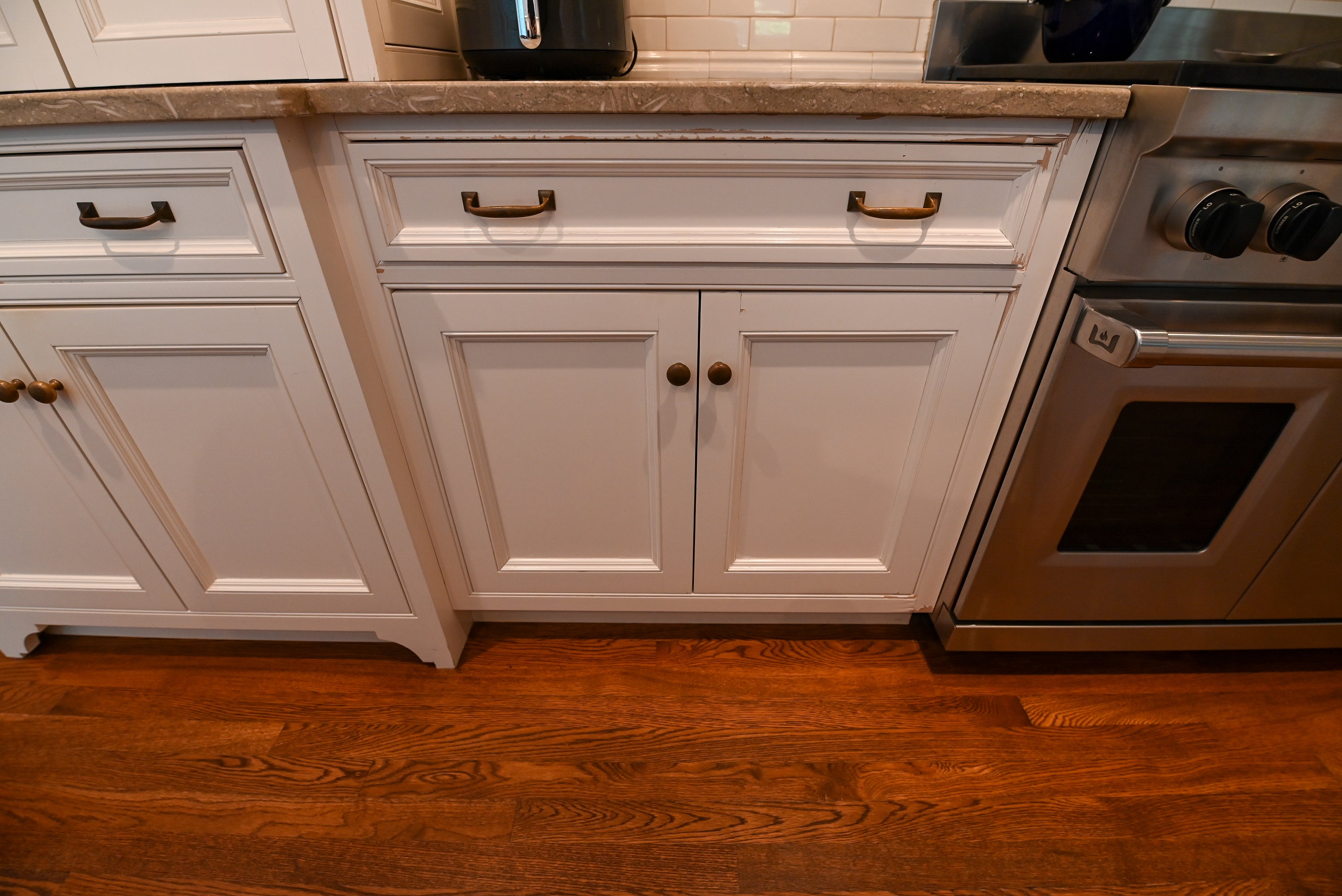 "The Montclair" Transitional White Kitchen with Island & Wolf 48" Range