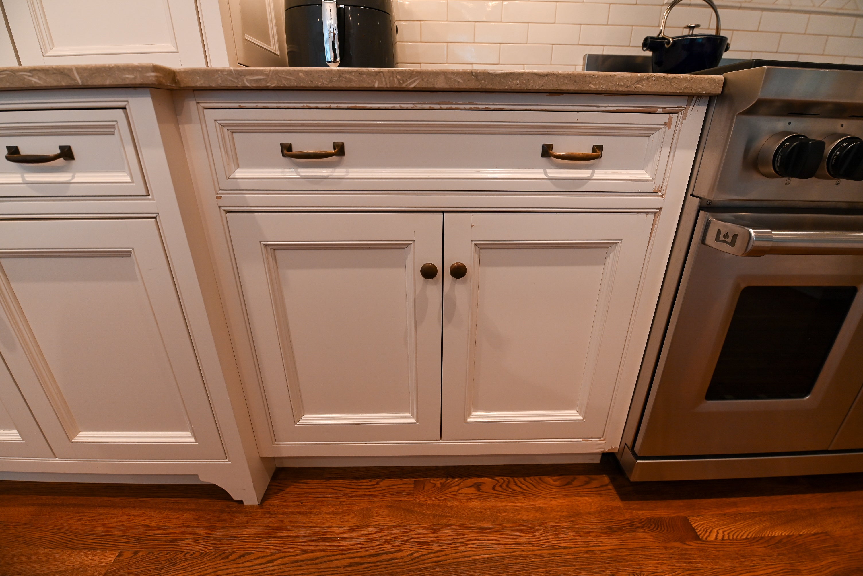 "The Montclair" Transitional White Kitchen with Island & Wolf 48" Range