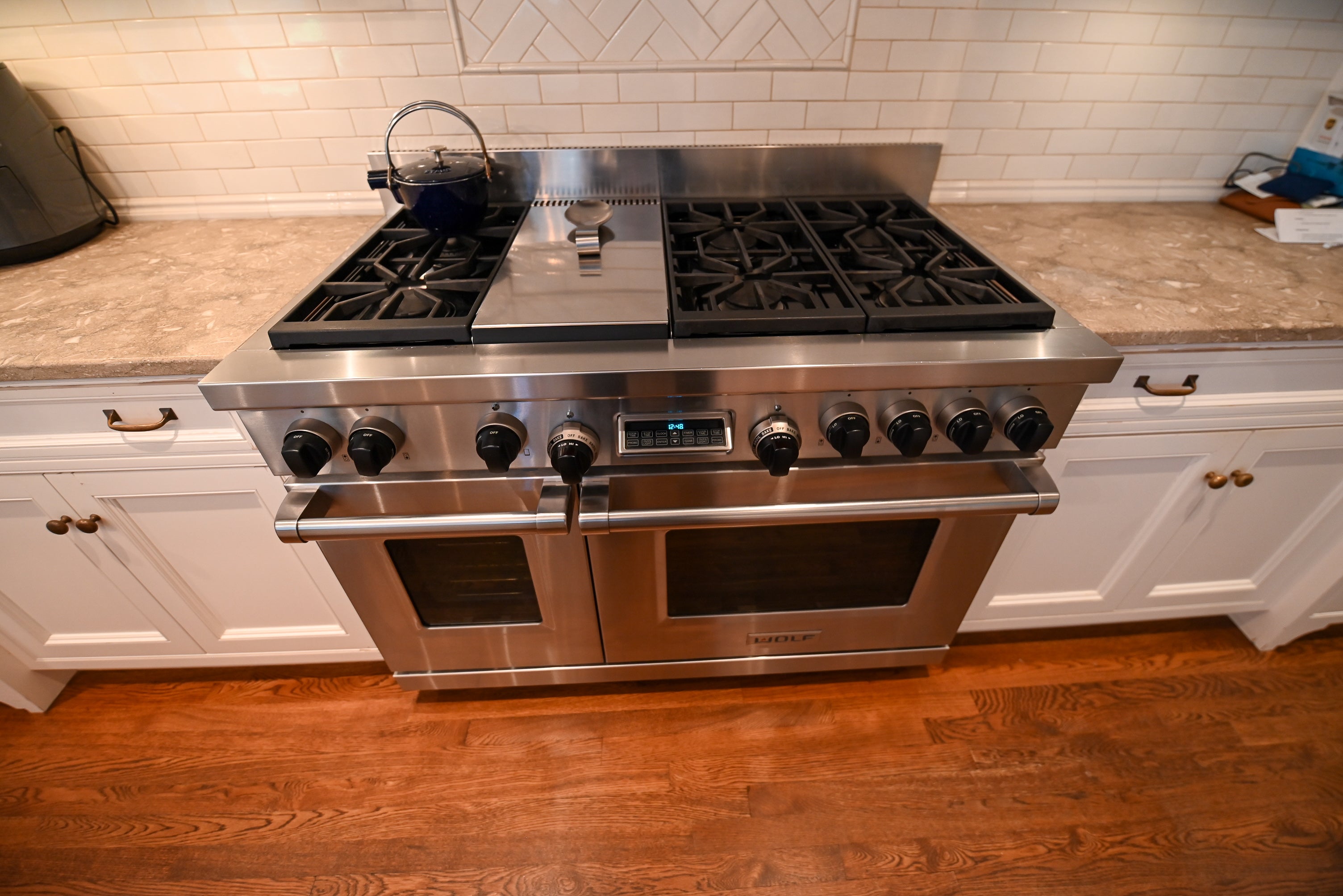 "The Montclair" Transitional White Kitchen with Island & Wolf 48" Range