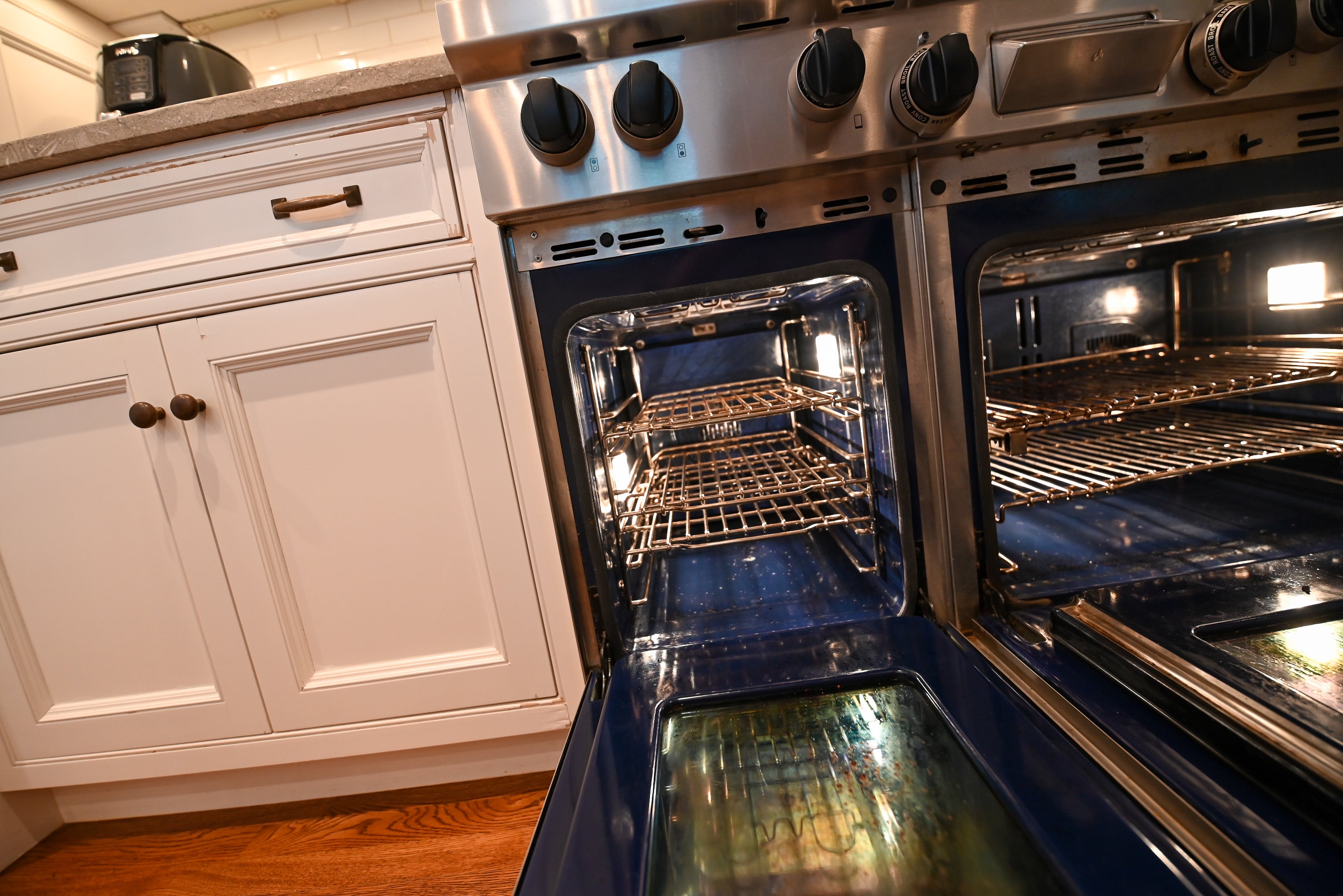 "The Montclair" Transitional White Kitchen with Island & Wolf 48" Range