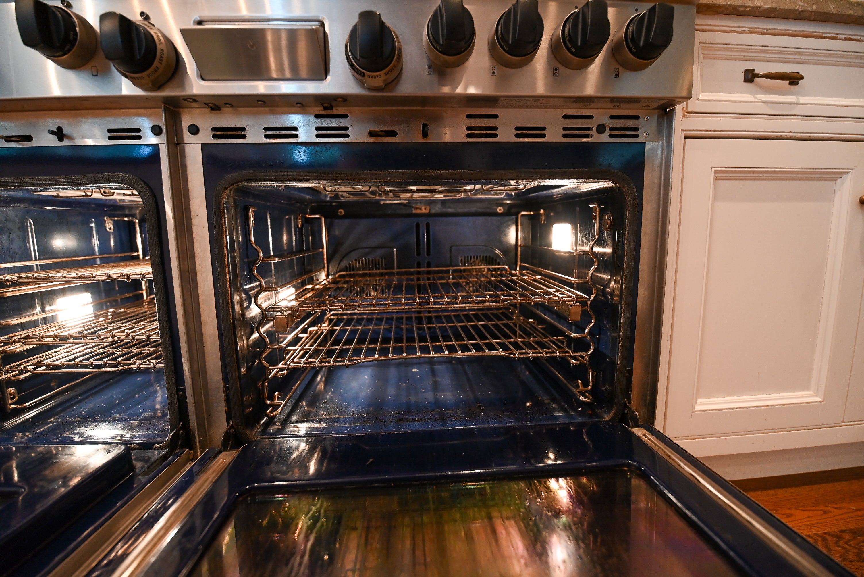 "The Montclair" Transitional White Kitchen with Island & Wolf 48" Range