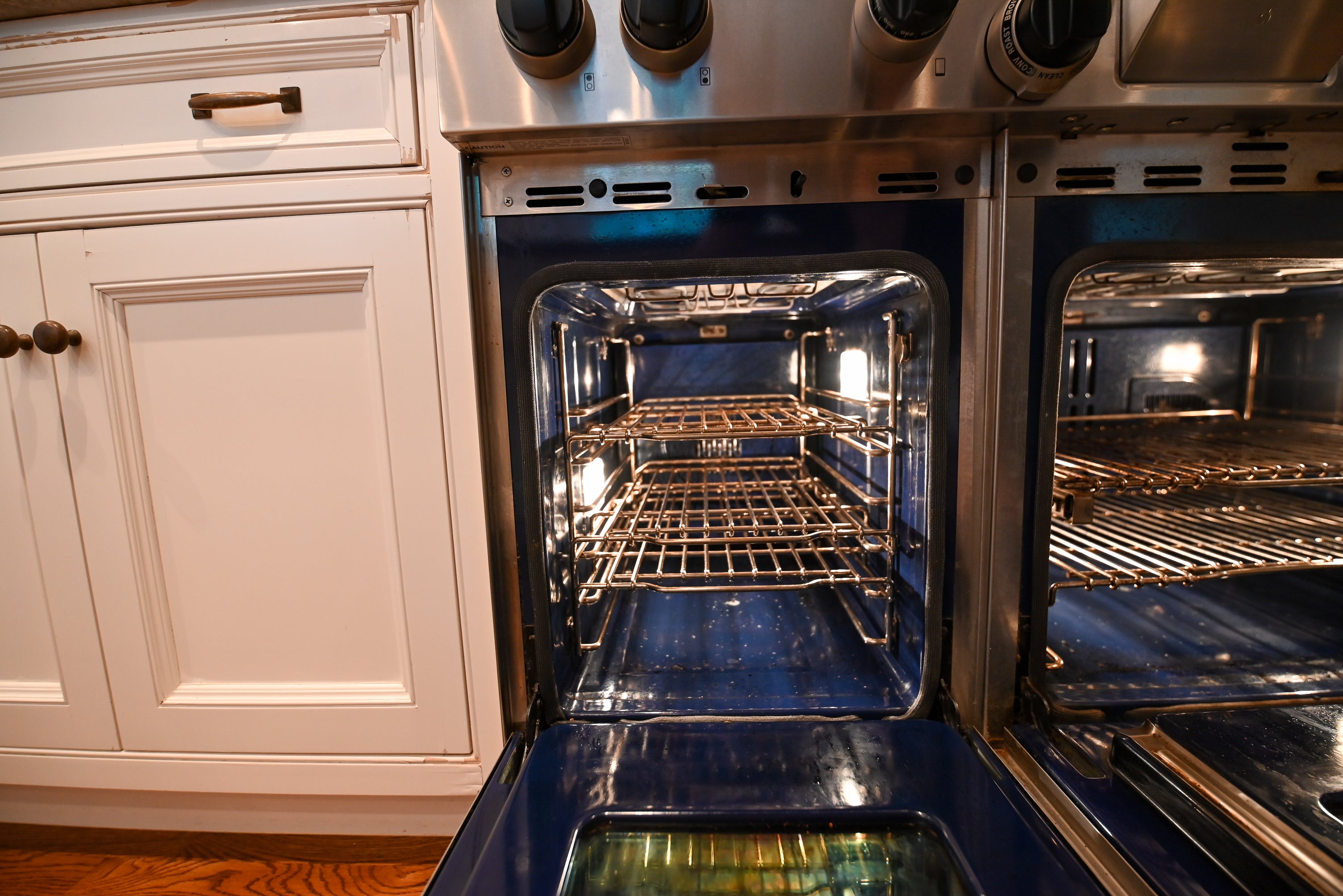 "The Montclair" Transitional White Kitchen with Island & Wolf 48" Range