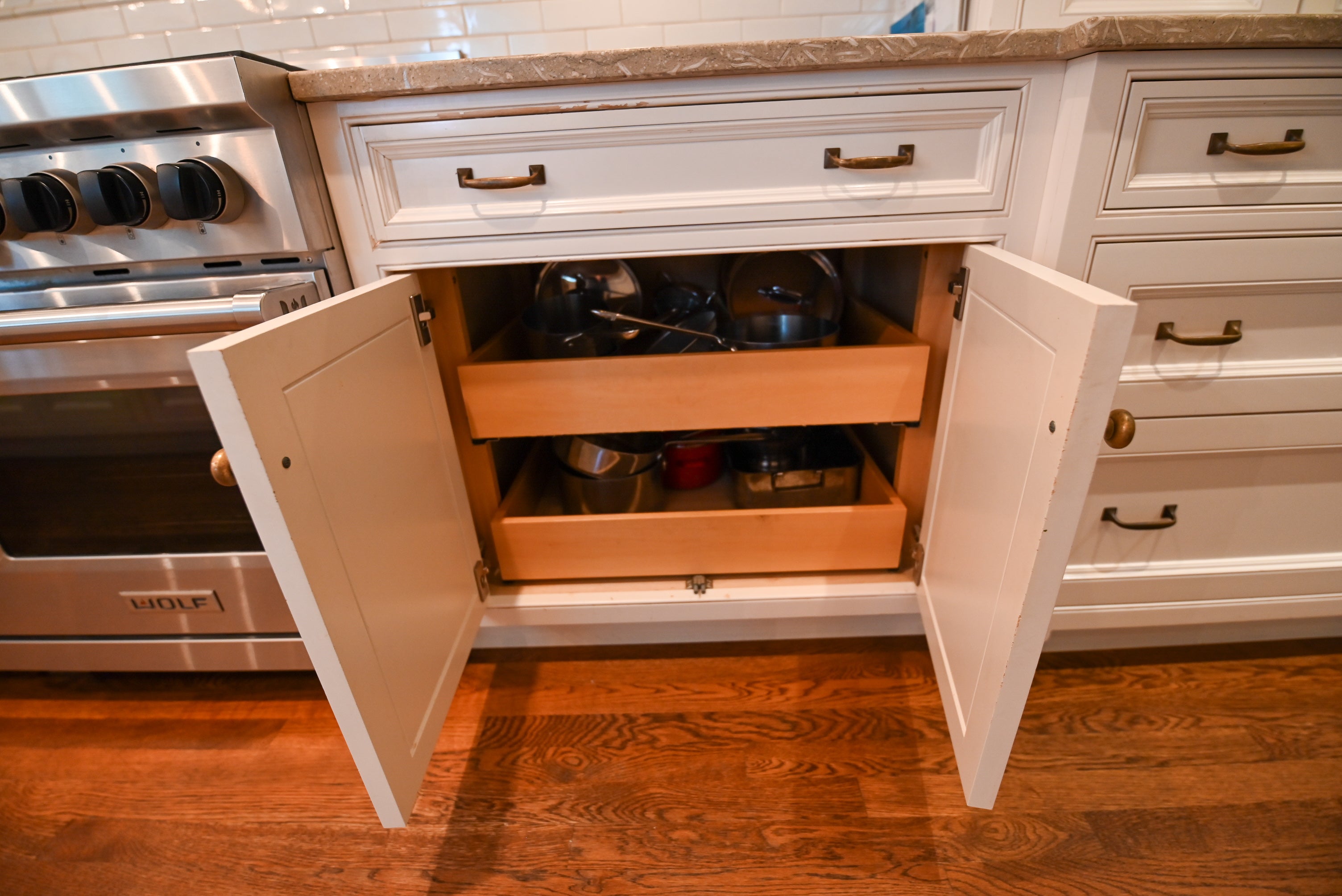 "The Montclair" Transitional White Kitchen with Island & Wolf 48" Range