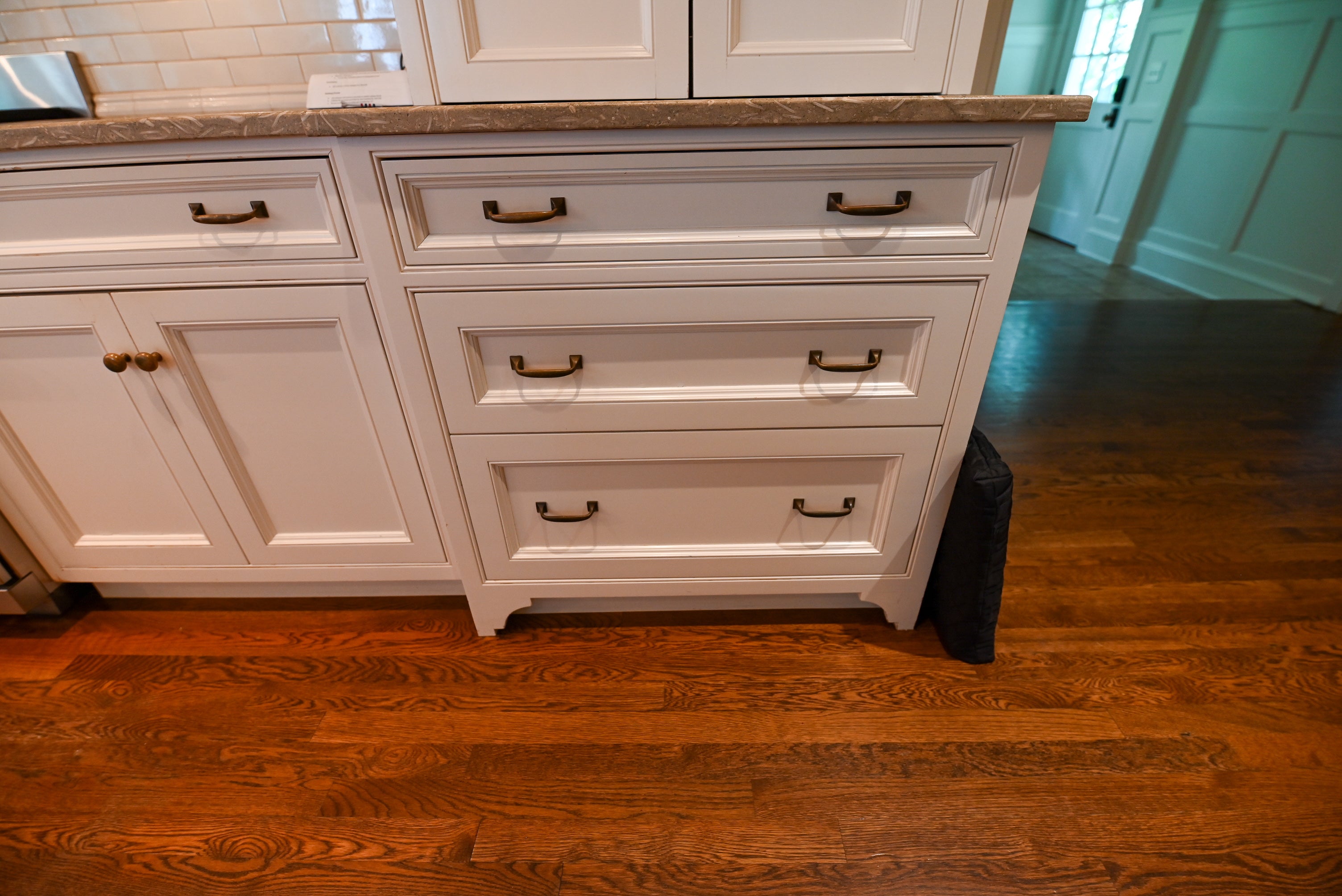 "The Montclair" Transitional White Kitchen with Island & Wolf 48" Range